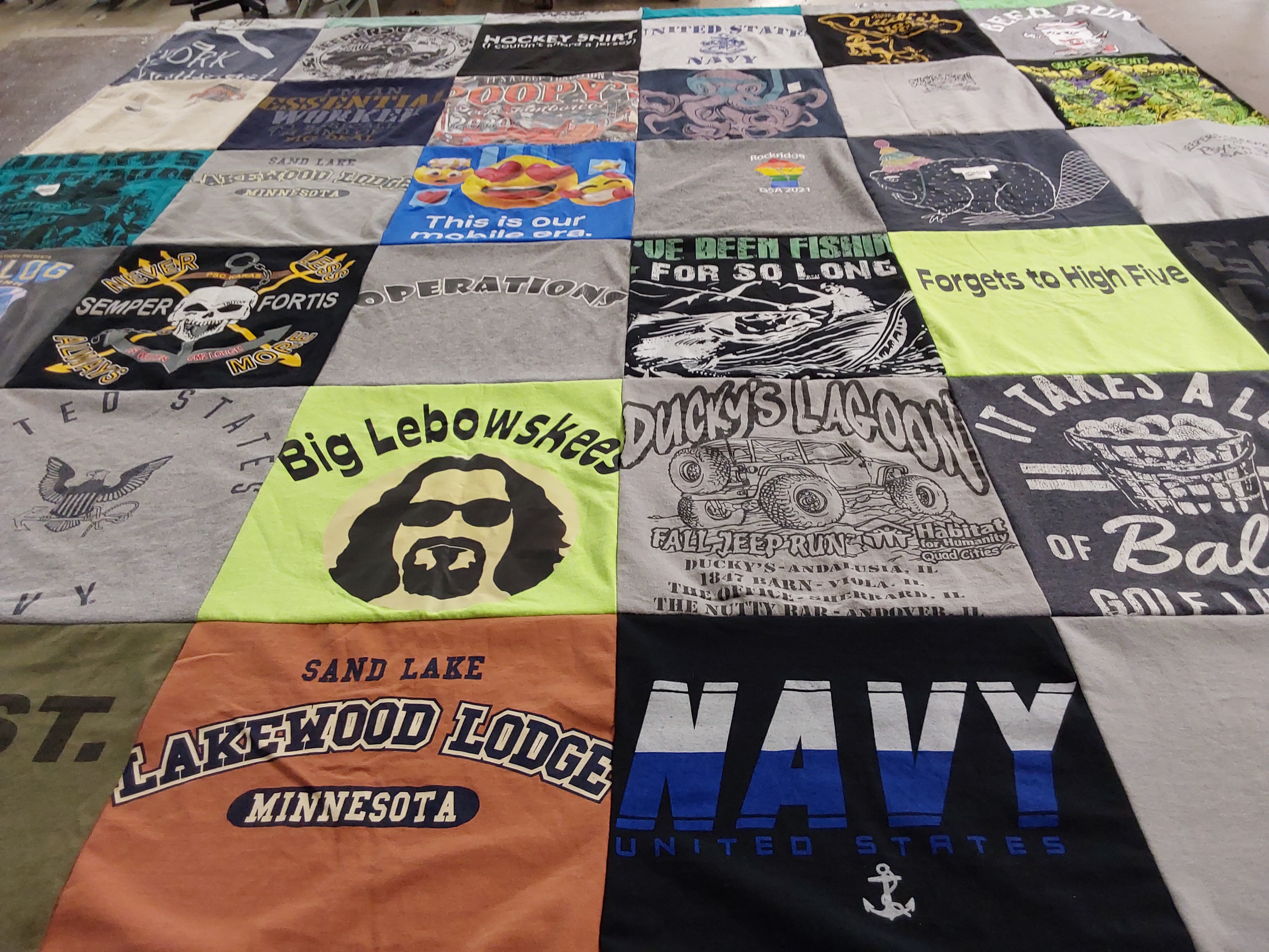 T-shirt quilt with fishing, hockey themes by Peggy from IL