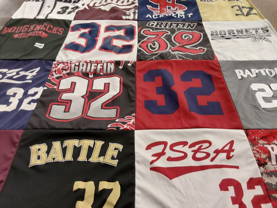 T-shirt quilt featuring griffin hornets, raptors by Melanie from AR