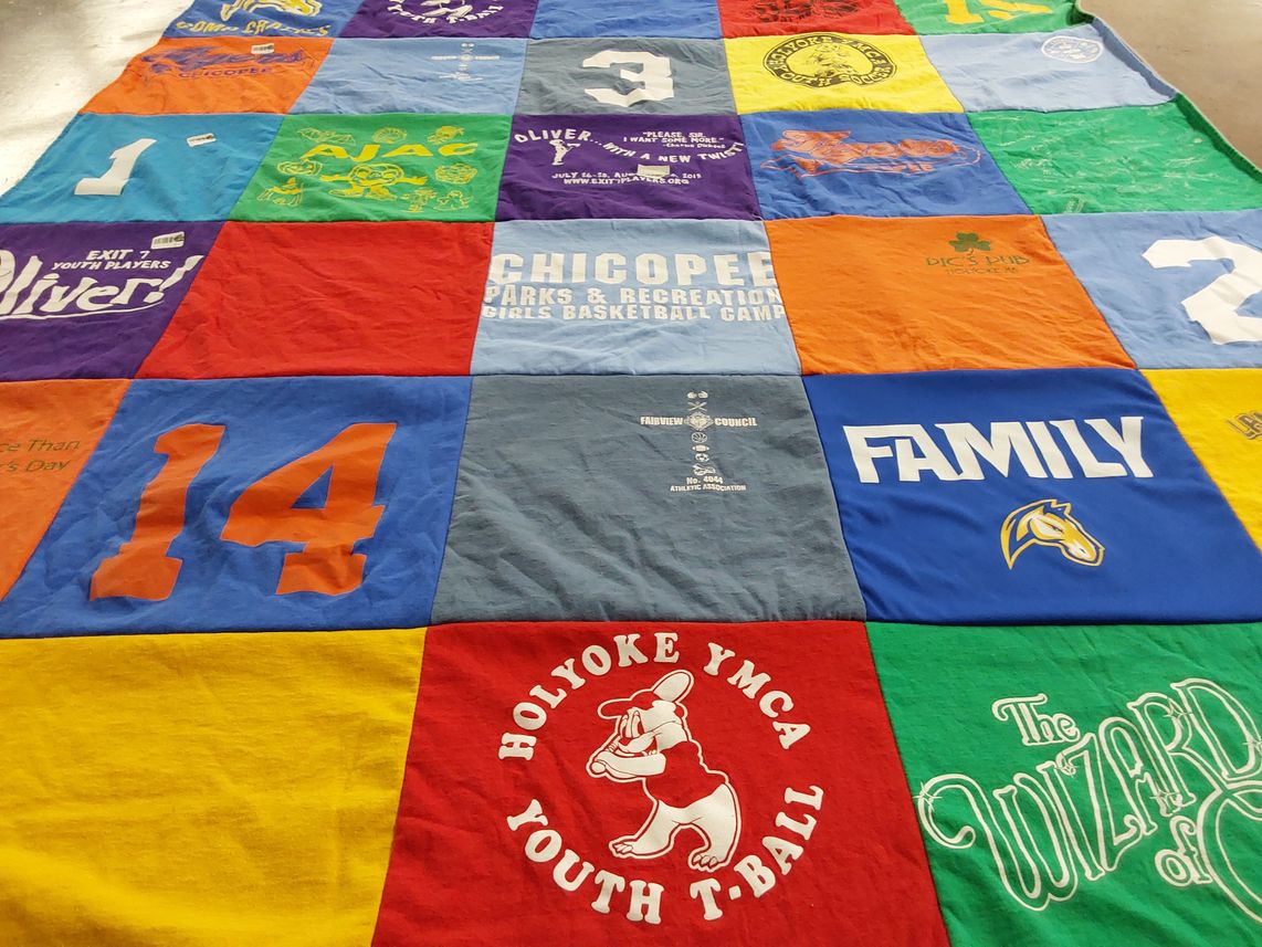 T-shirt quilt with youth sports, family activities themes by Kristin from MA