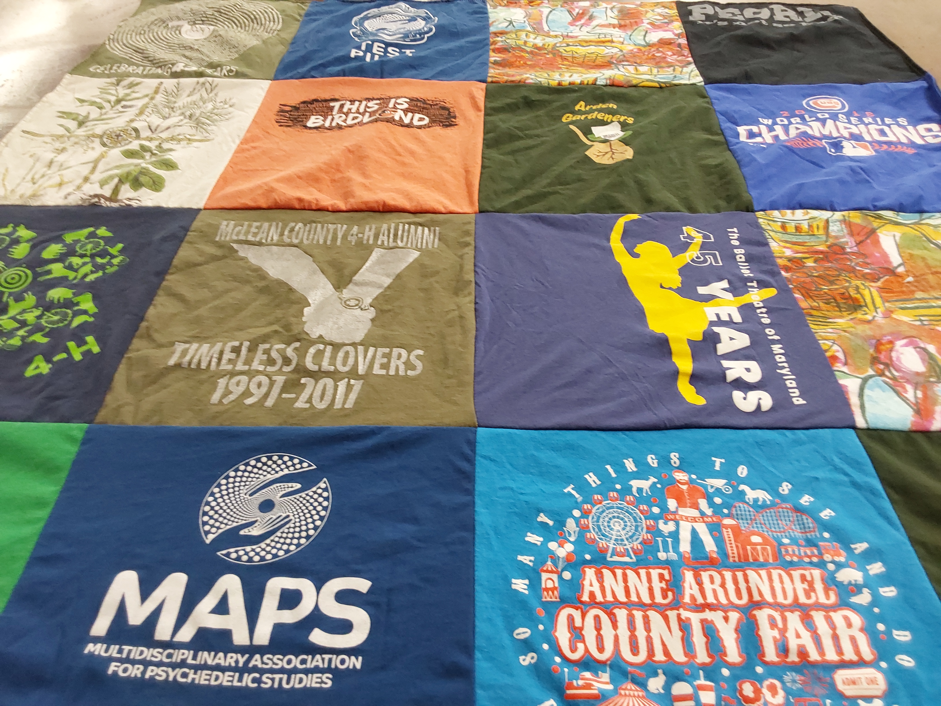T-shirt quilt with gardening, psychedelics themes by Patricia from MD