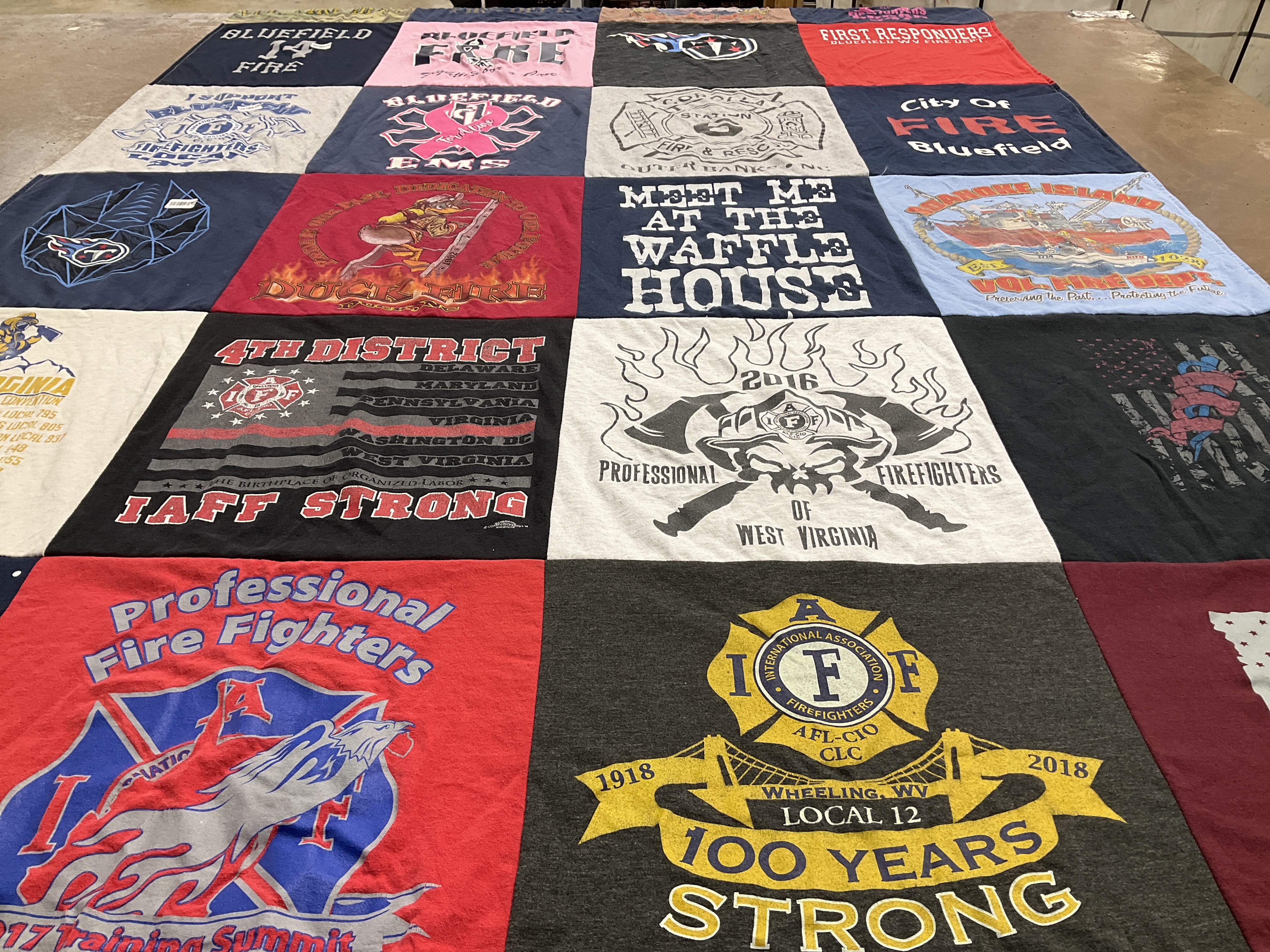 T-shirt quilt with firefighting, community service themes by Malynn from WV