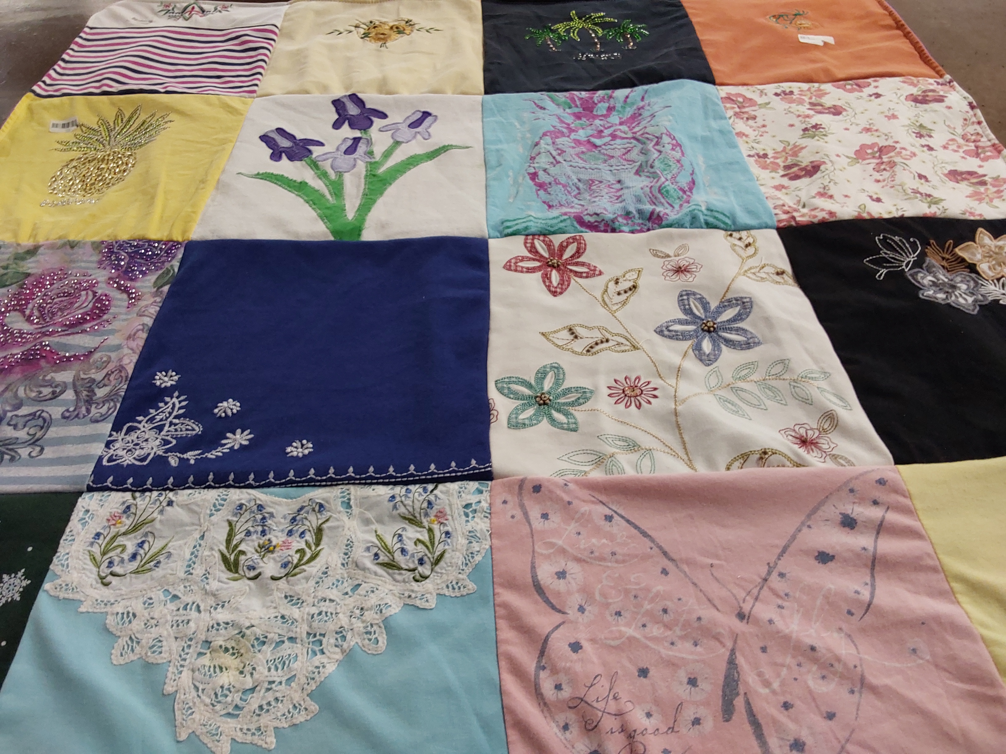 T-shirt quilt with gardening, embroidery themes by Andrea  from WI