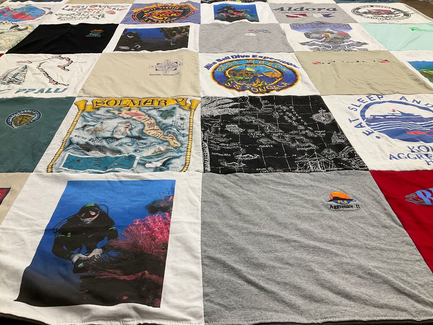 T-shirt quilt with diving, travel themes by Jill from AR