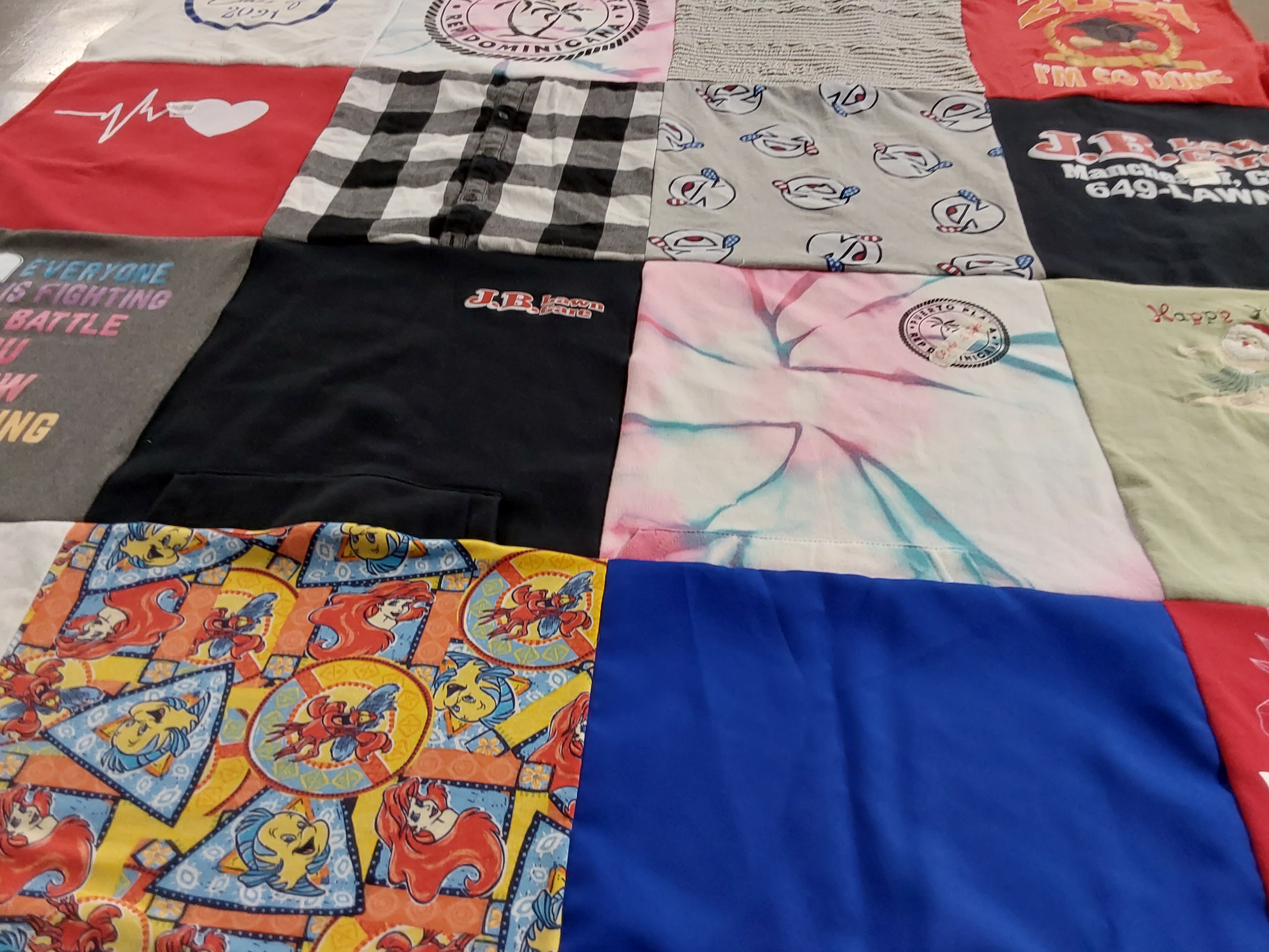 T-shirt quilt with art, music themes by Rebecca from CT