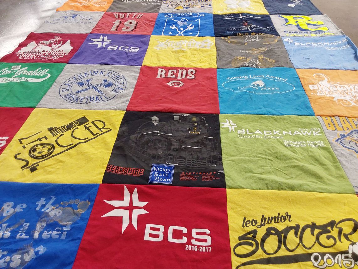T-shirt quilt featuring blacks, reds by Nichole from IN