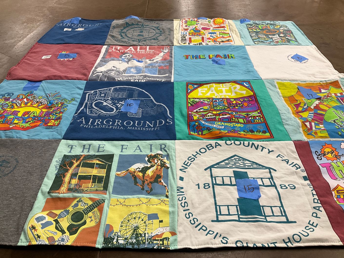 T-shirt quilt with fairs, music themes by Marty from LA