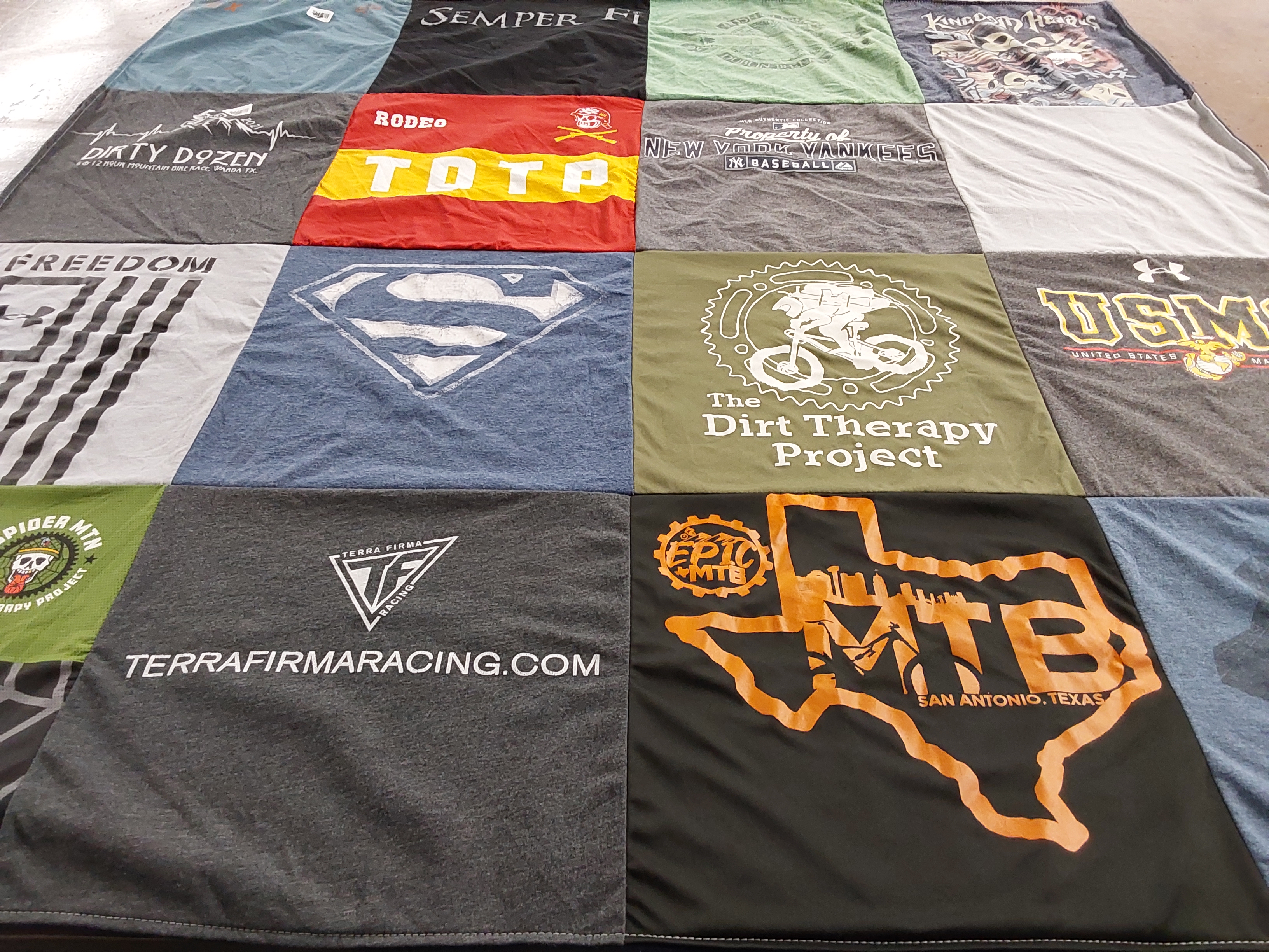 T-shirt quilt with bicycling, motorcycling themes by Judith from TX