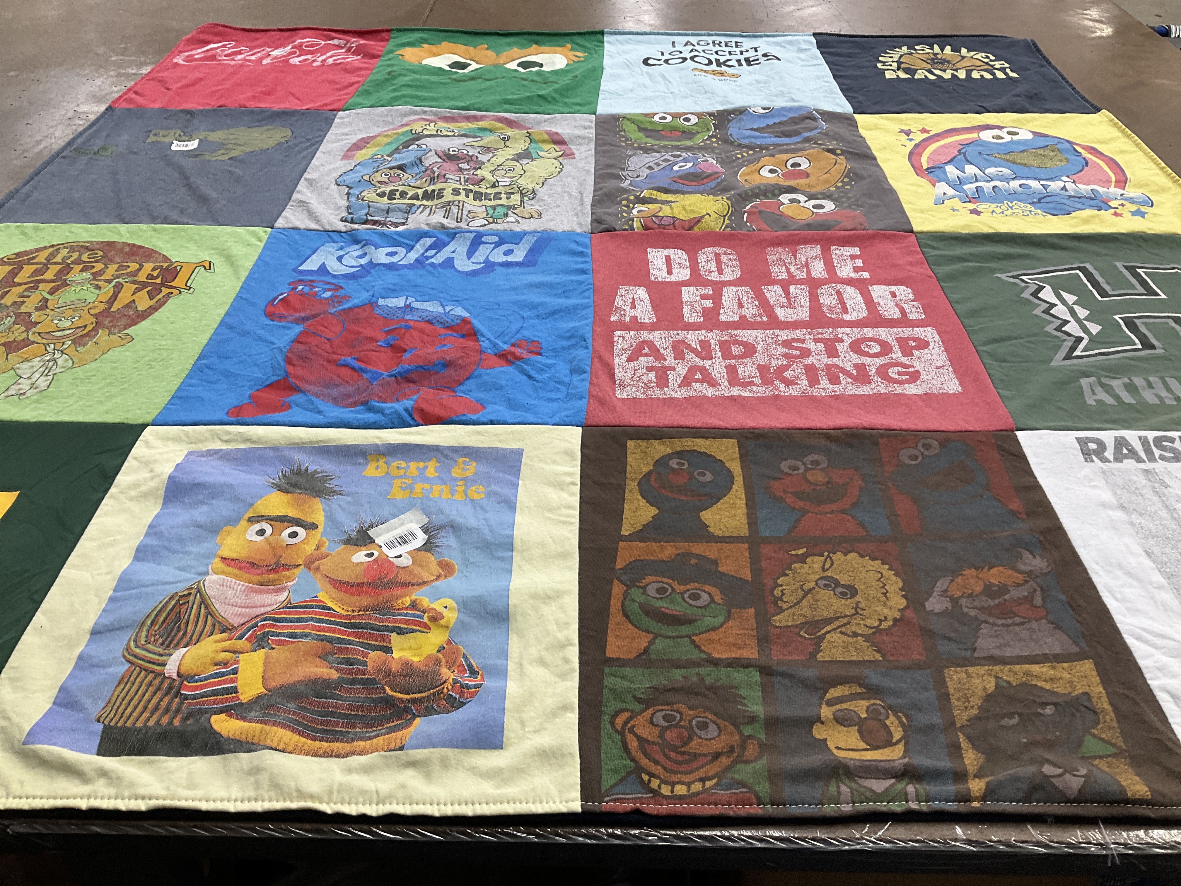 T-shirt quilt with puppetry, cartoons themes by Julie from WA
