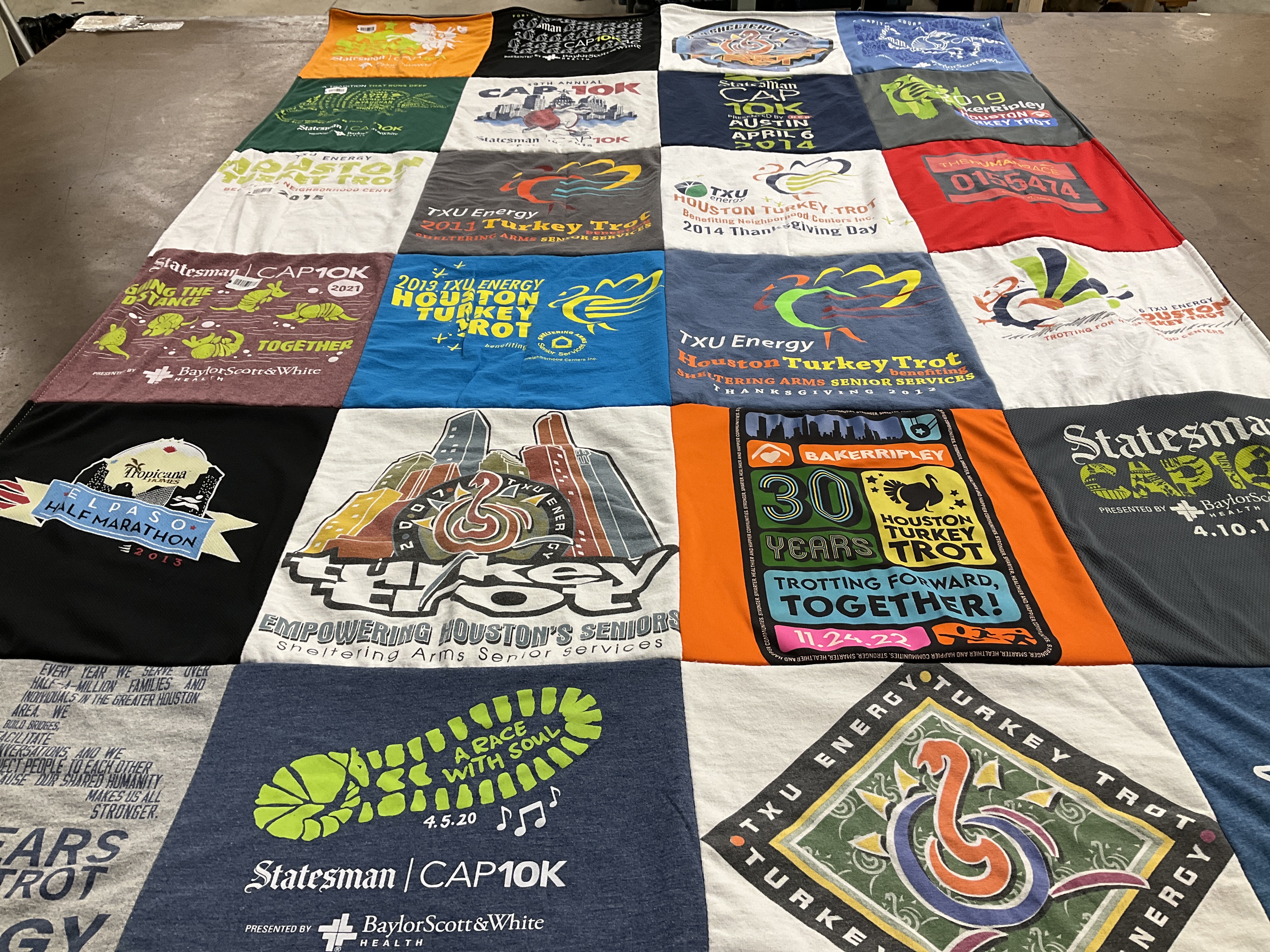 T-shirt quilt with running, community service themes by maaya from TX