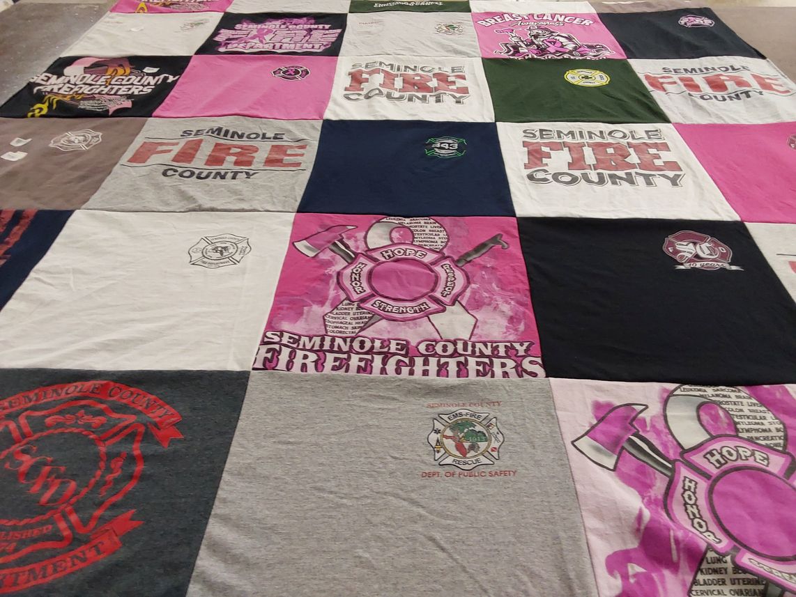 T-shirt quilt with firefighting, community service themes by Sarah from FL
