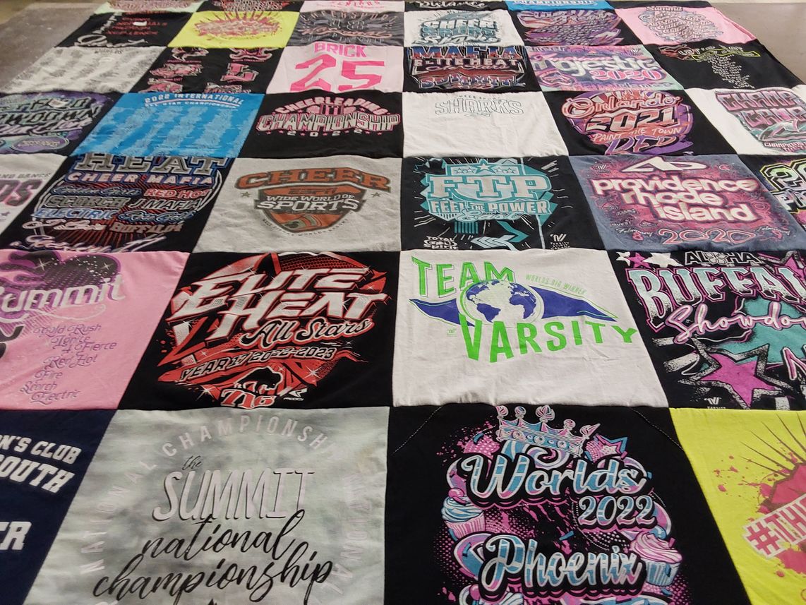 T-shirt quilt with cheerleading, sports themes by Cheryl from NY