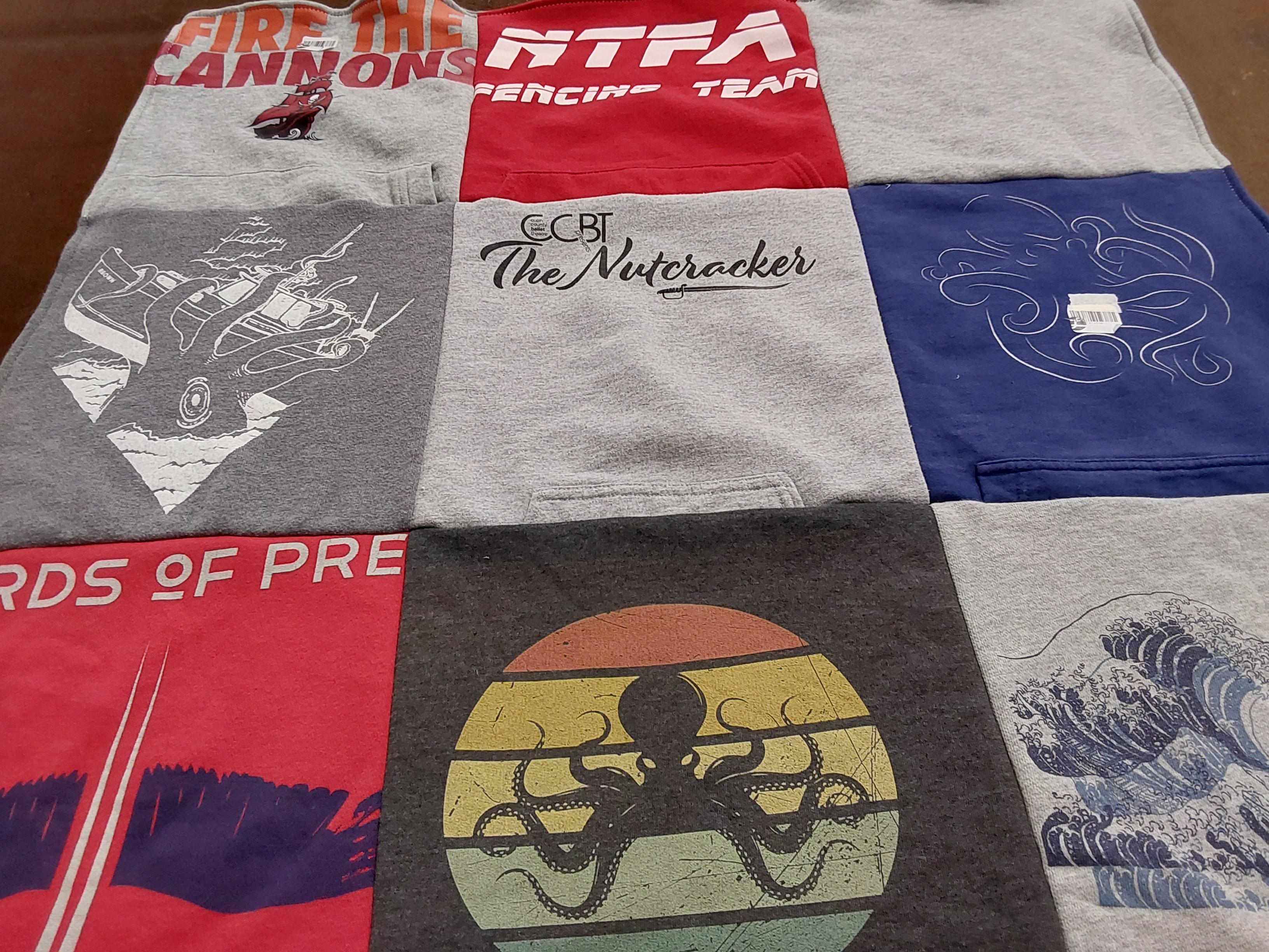 T-shirt quilt with fencing, theater themes by Laura from TX