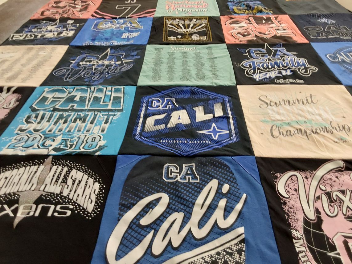 T-shirt quilt with cheerleading, sports themes by Heidy from AZ