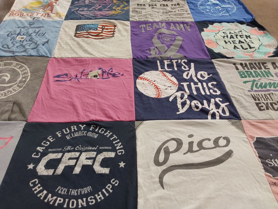 T-shirt quilt with sports, fighting themes by Sarah from NJ