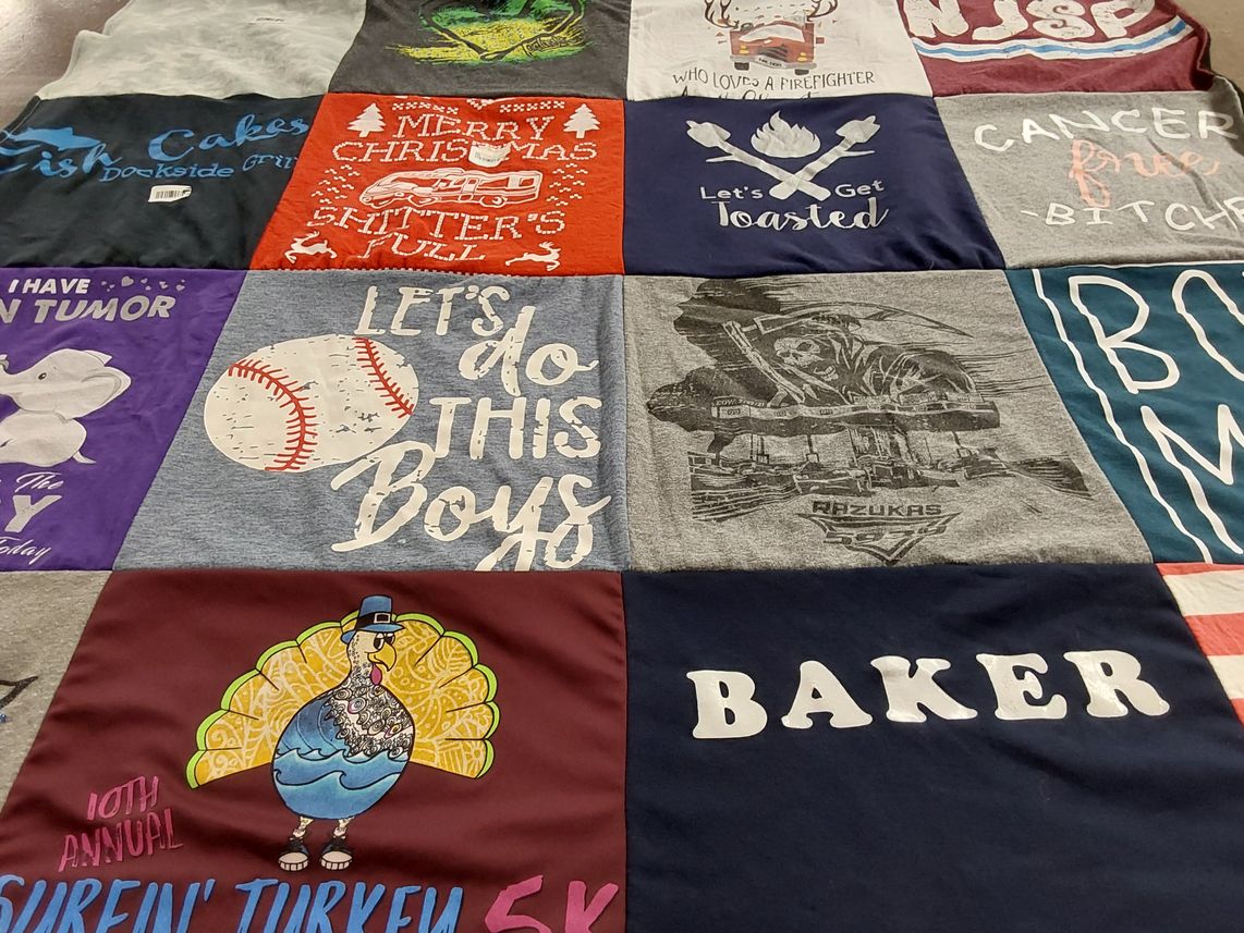 T-shirt quilt with cancer awareness, firefighters themes by Sarah from NJ