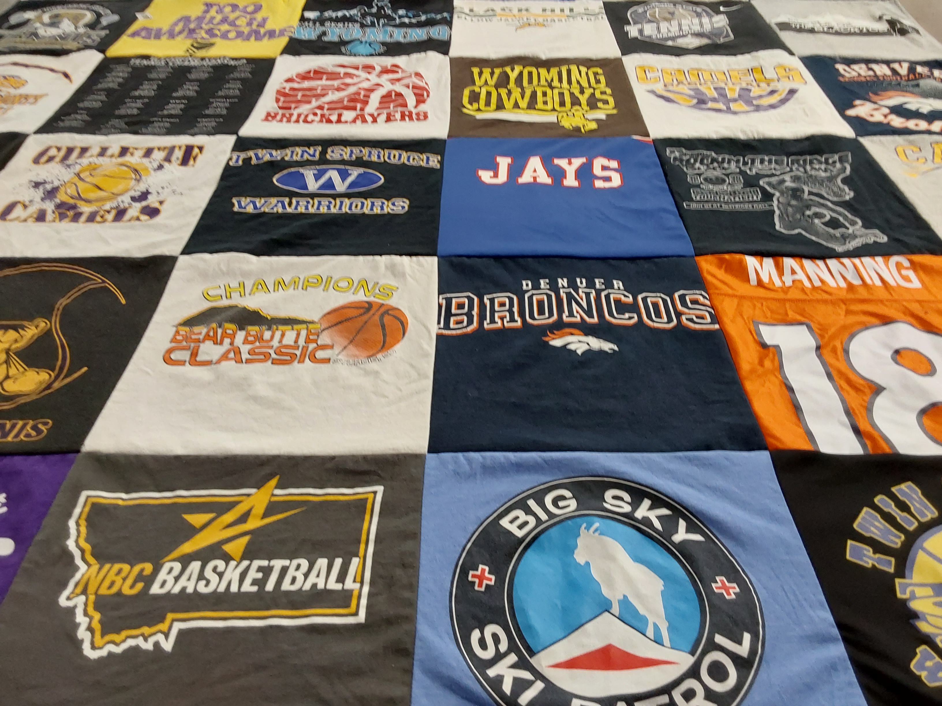 T-shirt quilt featuring denver broncos, wyoming cowboys by Cheryl from WY