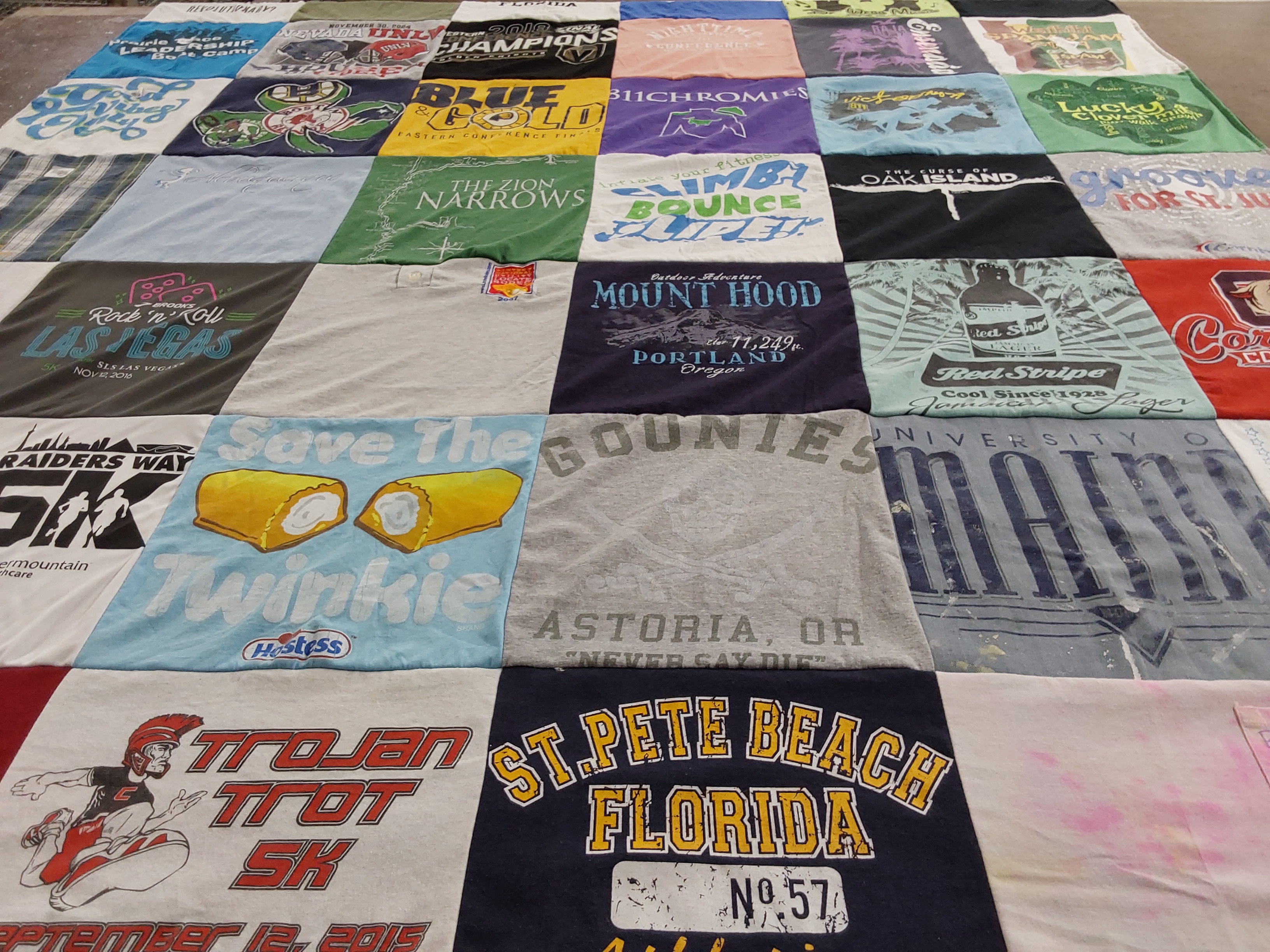 T-shirt quilt featuring trojan trotting team, raiders team by Sarah from NV