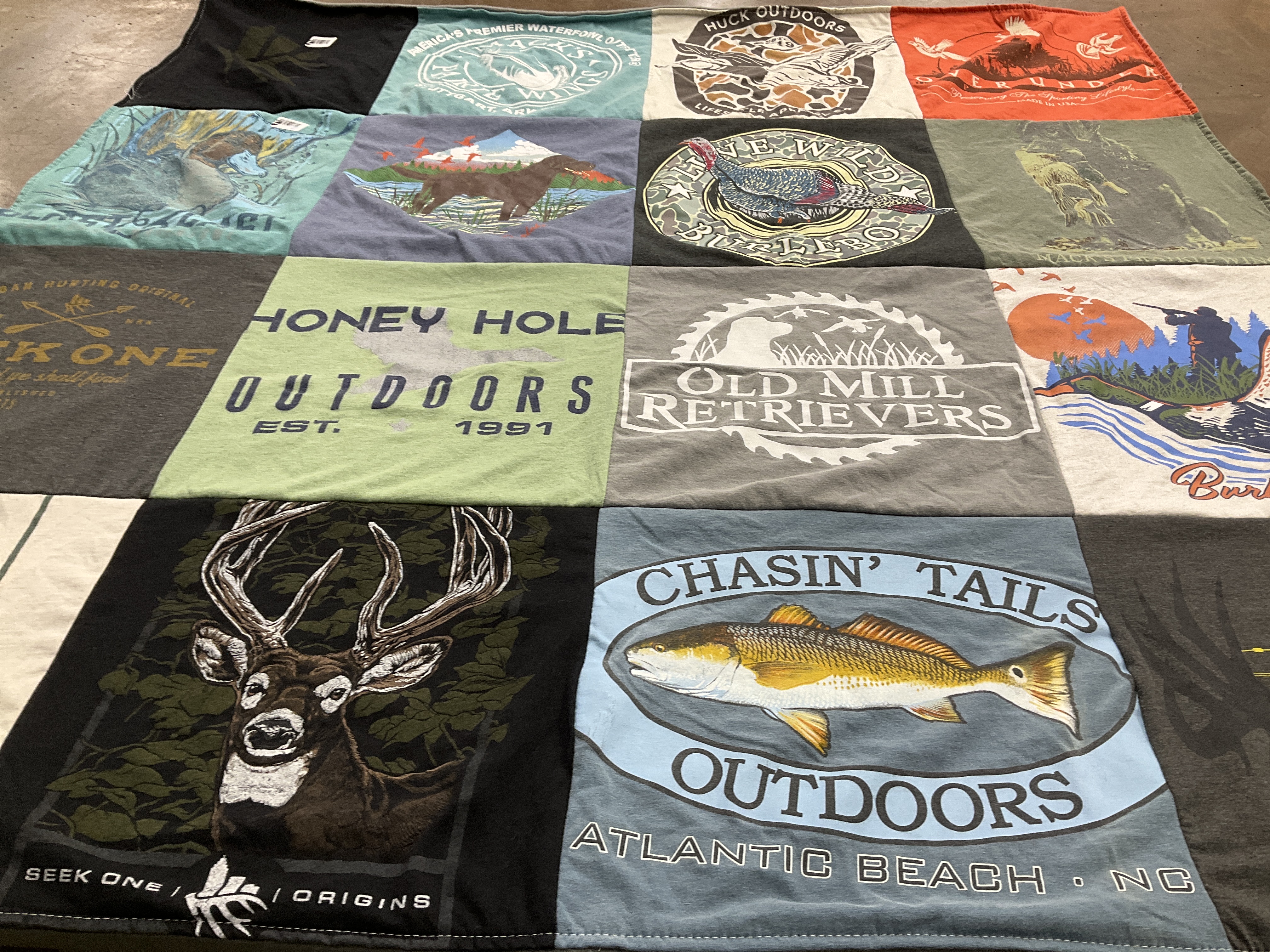 T-shirt quilt with hunting, fishing themes by Mackenzie from NC