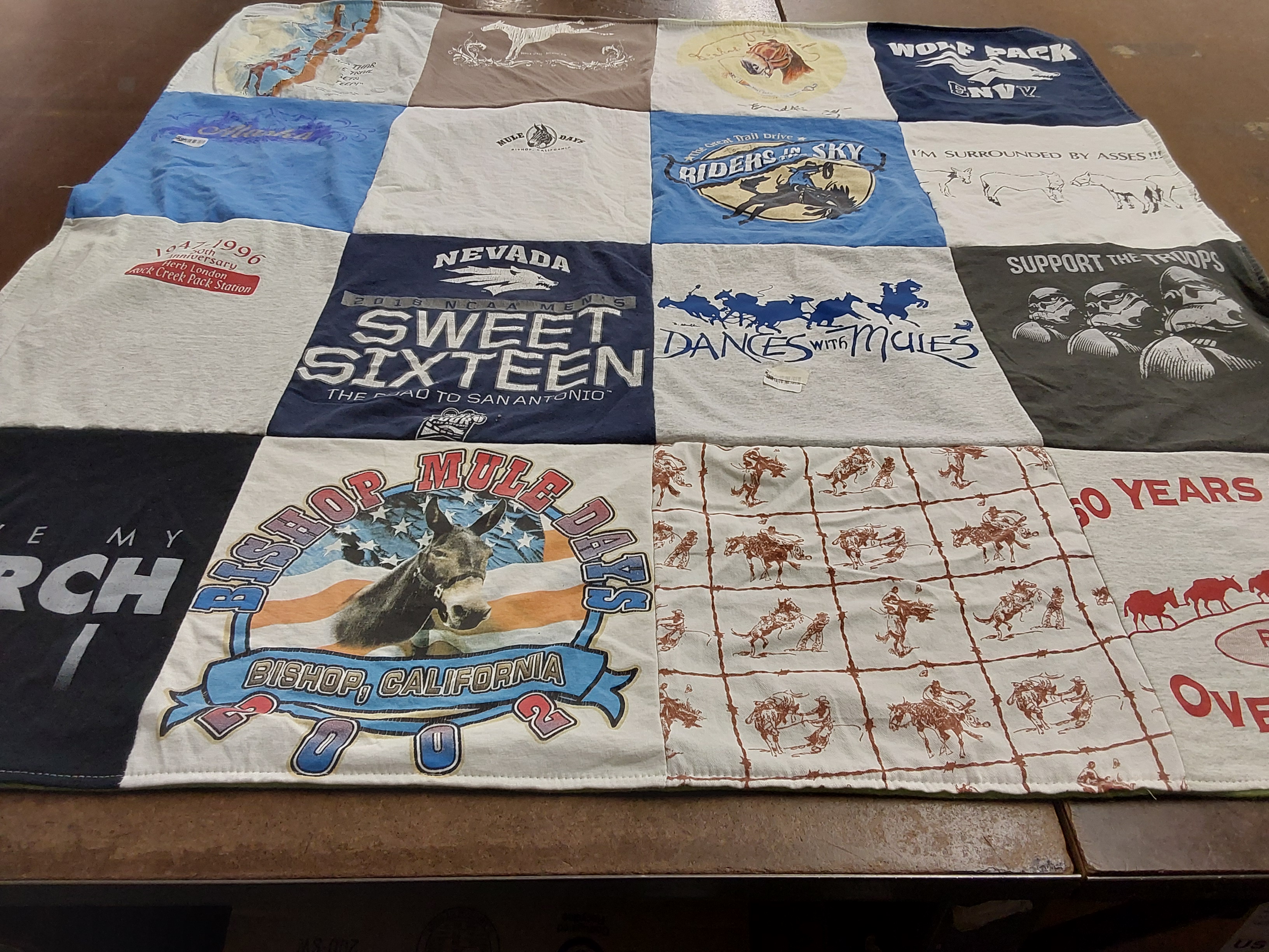 T-shirt quilt featuring wolf pack by Cherie from NV