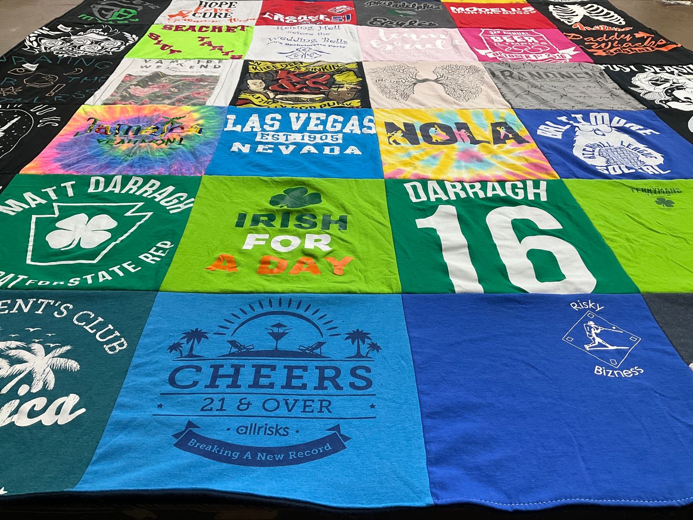 T-shirt quilt with sports, gambling themes by Julia from MD