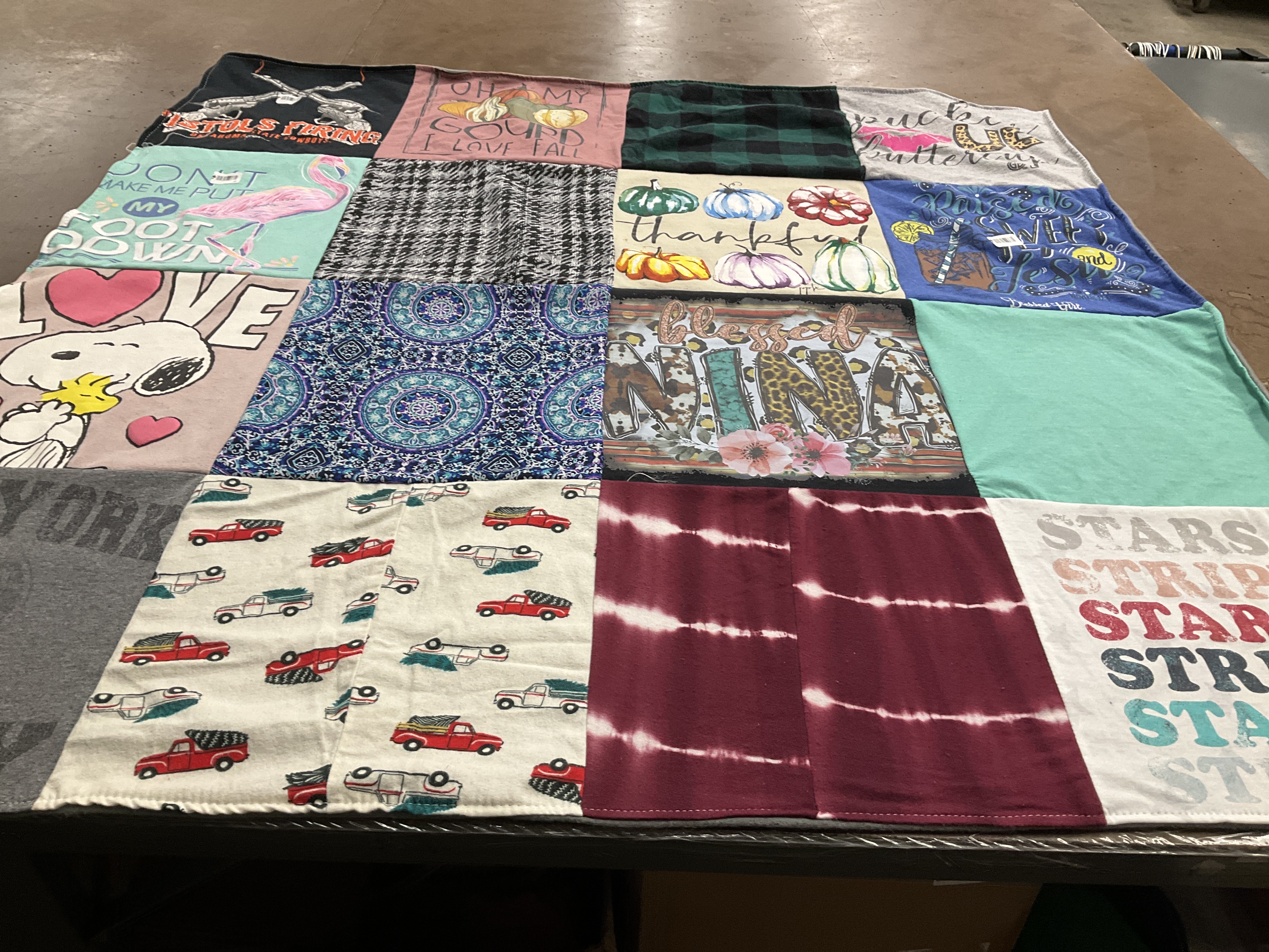 T-shirt quilt with fall decor, snoopy themes by Christie from OK