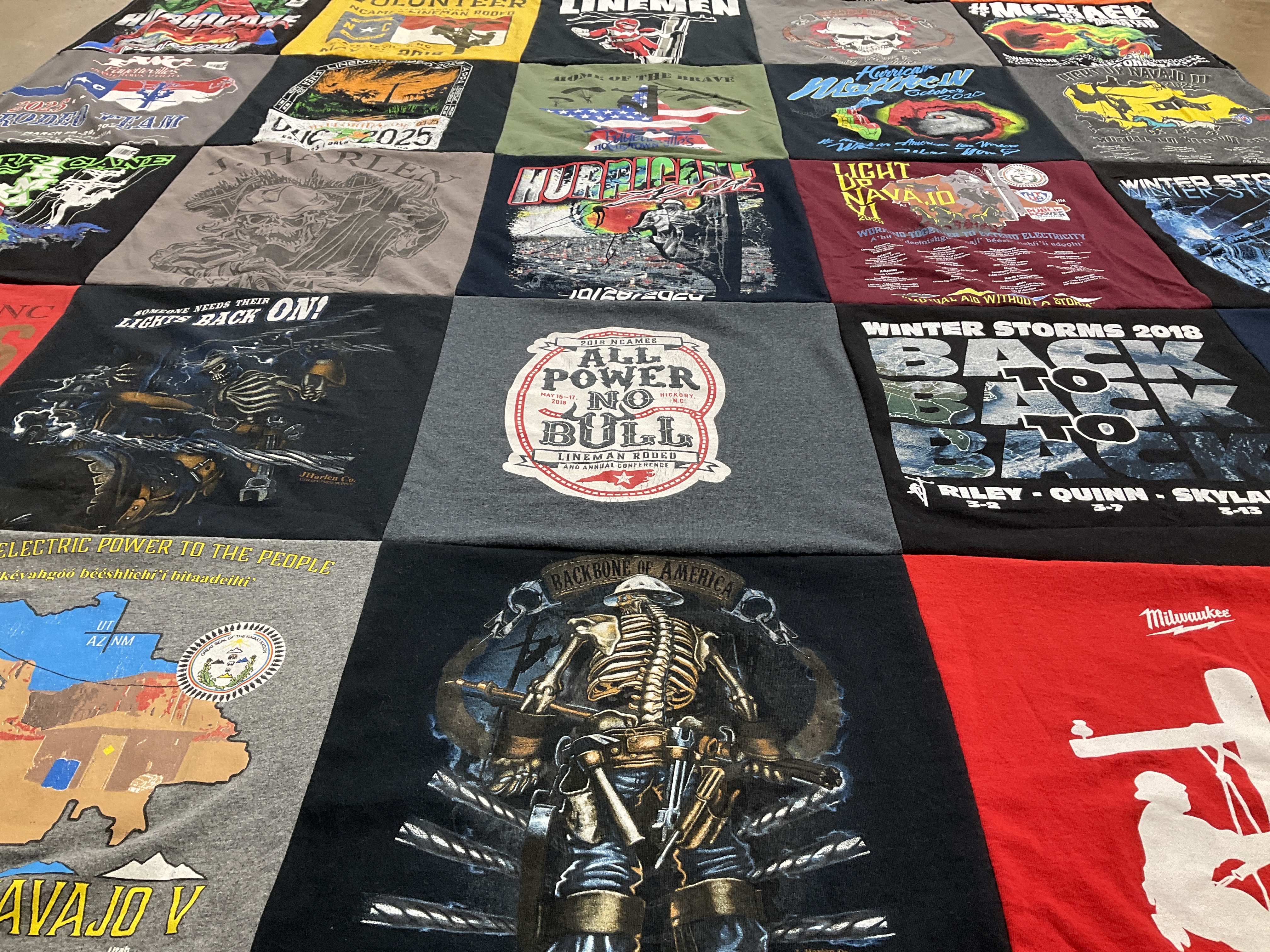 T-shirt quilt with electricity, energy themes by Marshall from NC