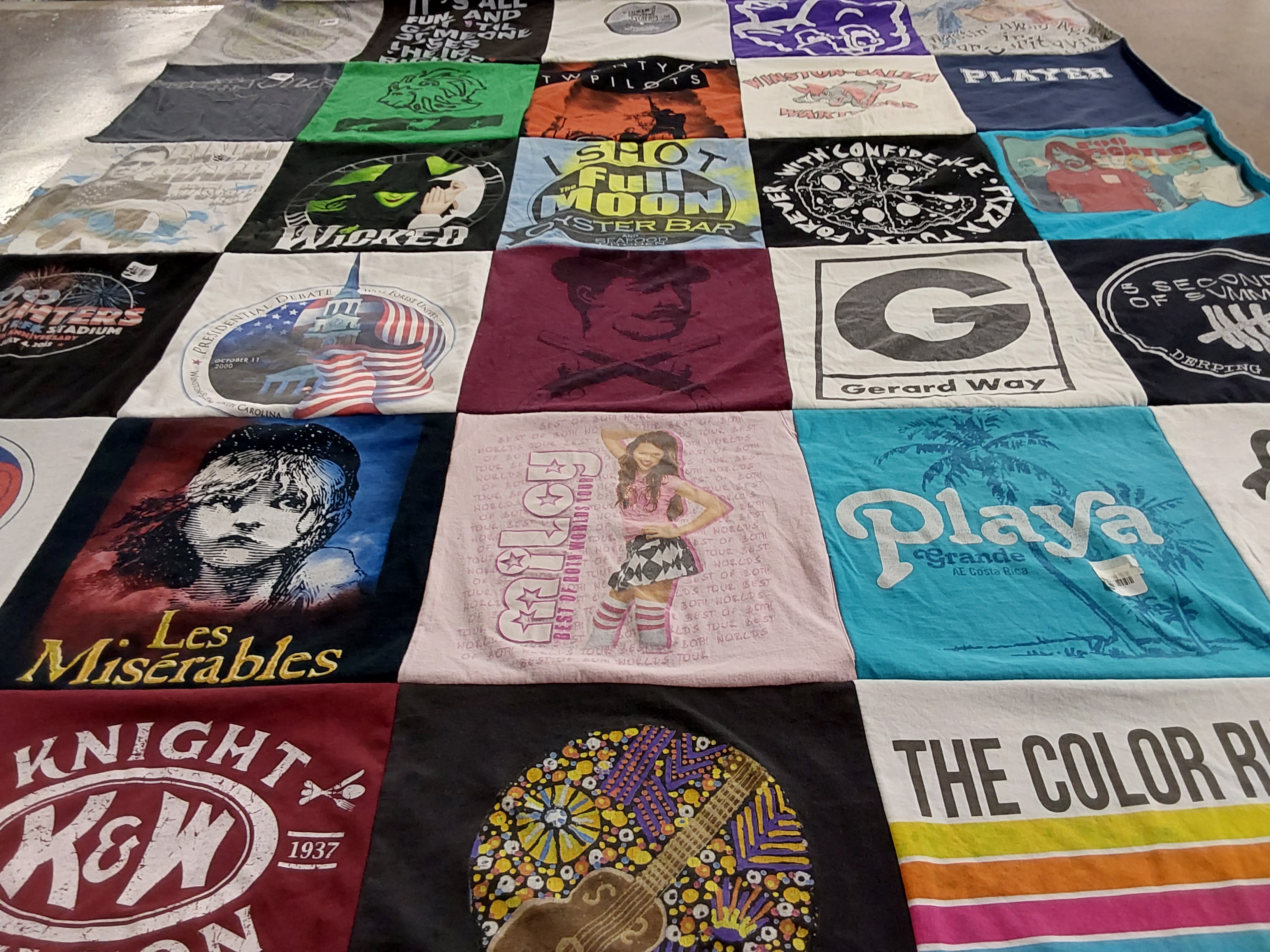T-shirt quilt with theater, music themes by Regina from NC
