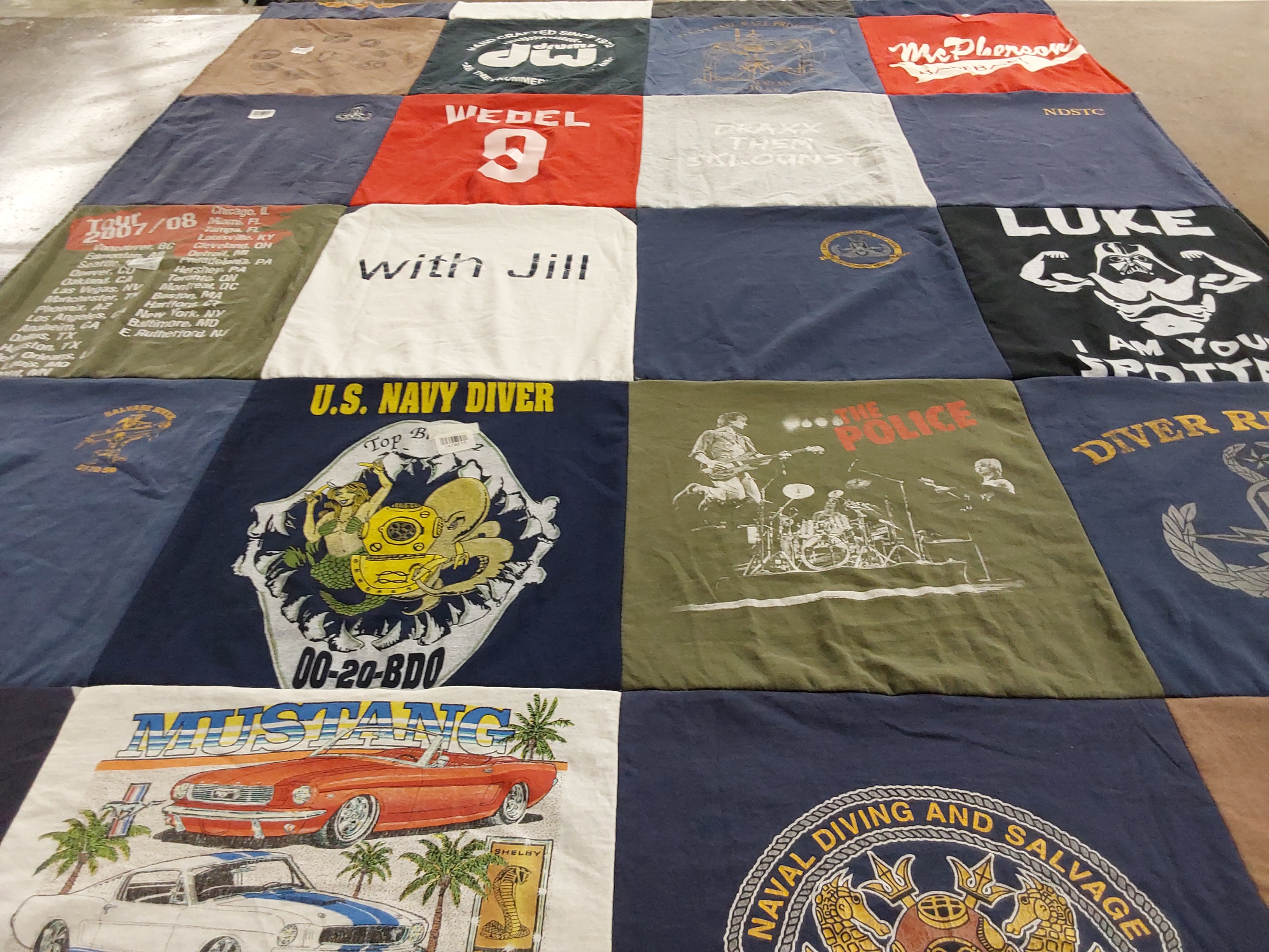 T-shirt quilt with diving, music themes by Jill from KS