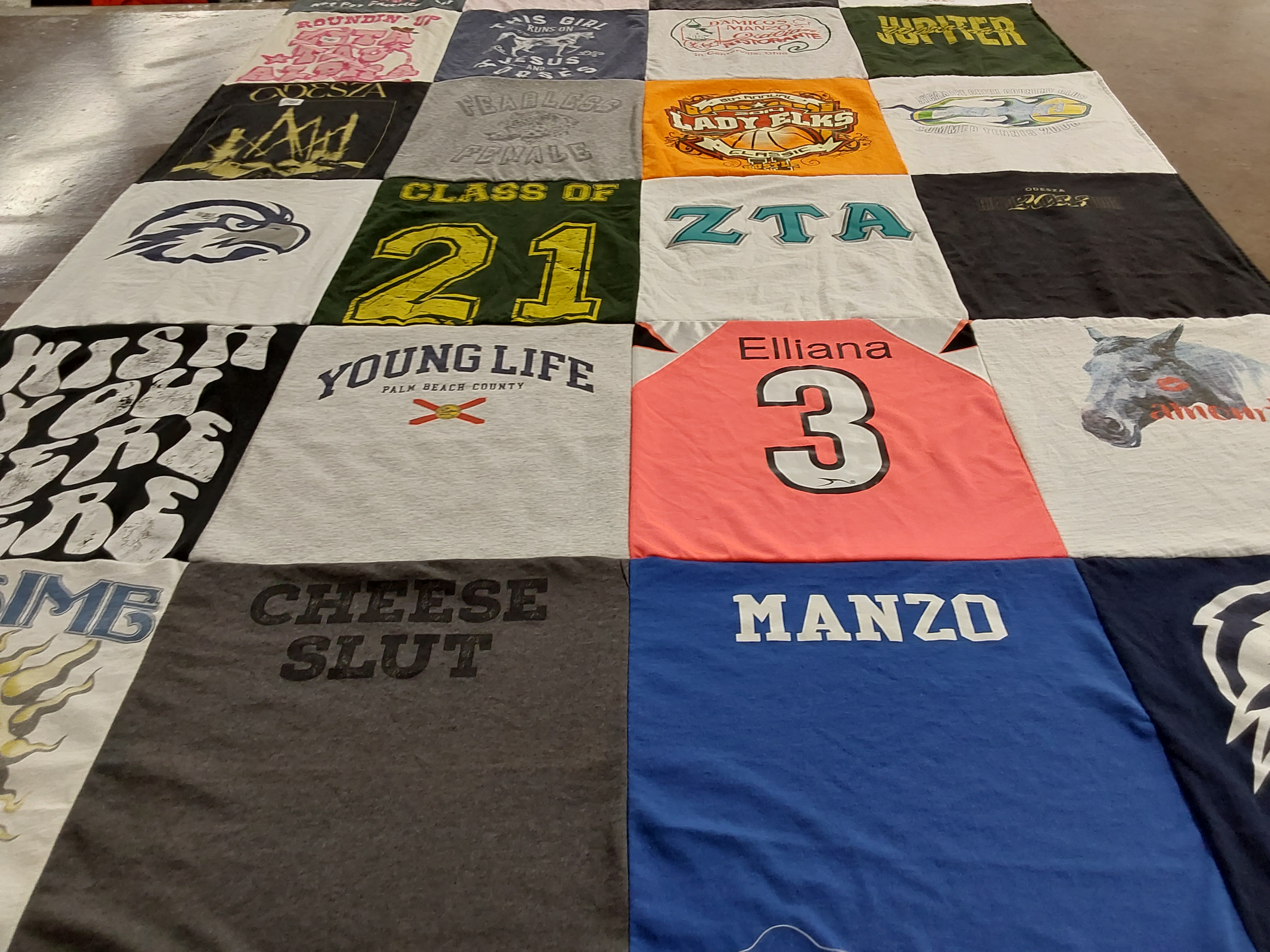 T-shirt quilt with sports, education themes by Robyn from FL
