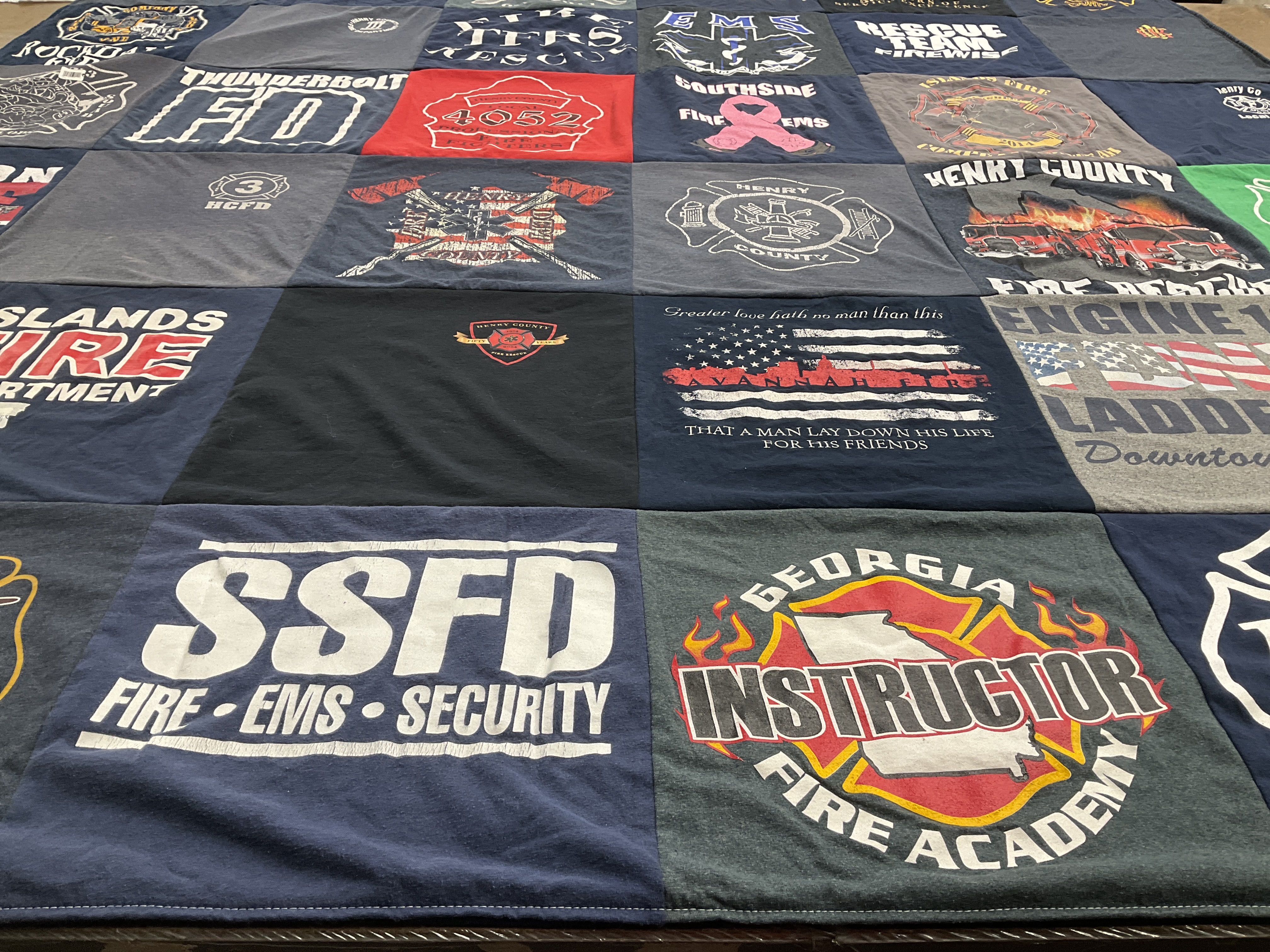 T-shirt quilt with firefighting, emergency services themes by Sarah from GA