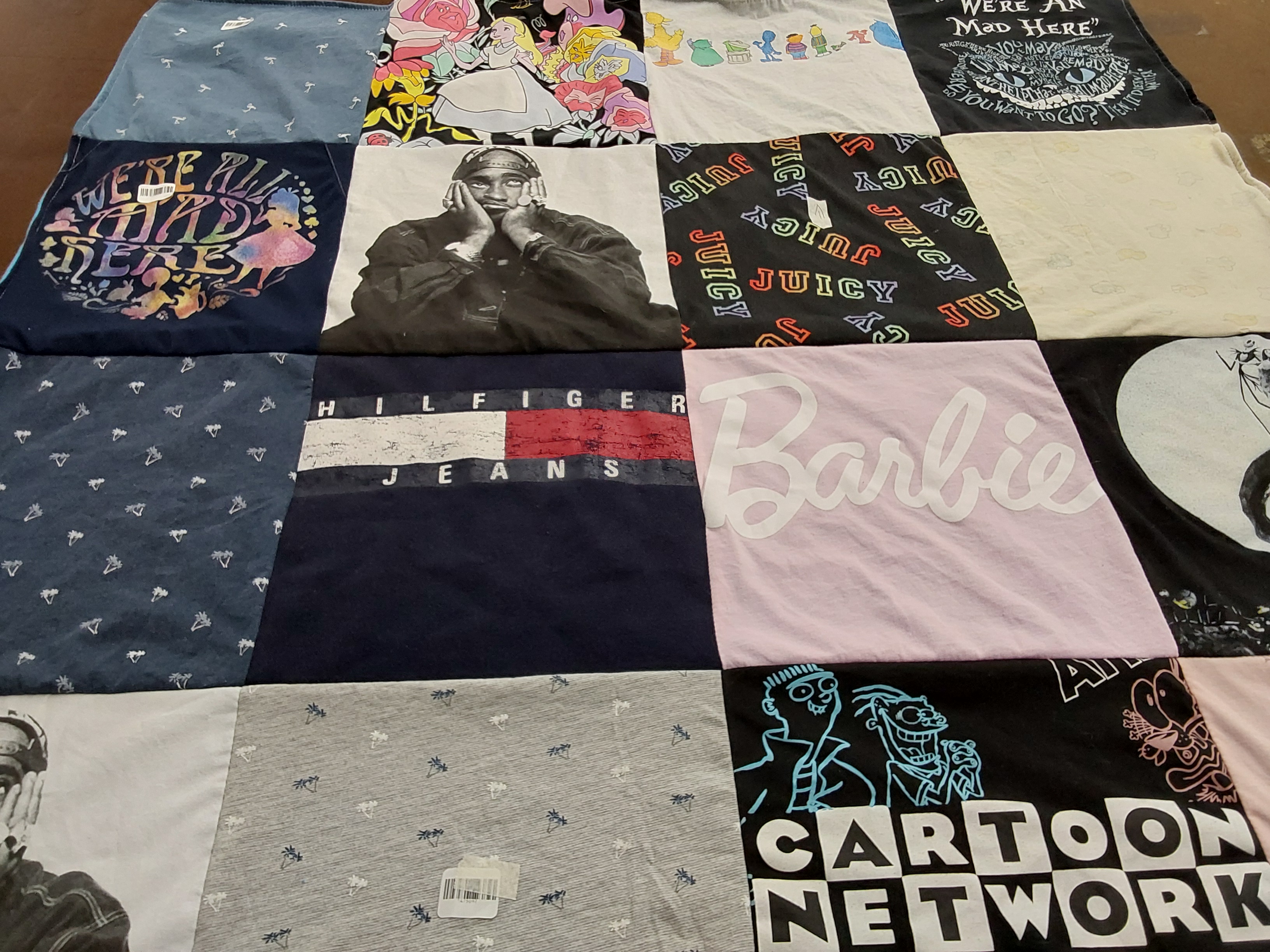 T-shirt quilt with music, pop culture themes by Donna from FL