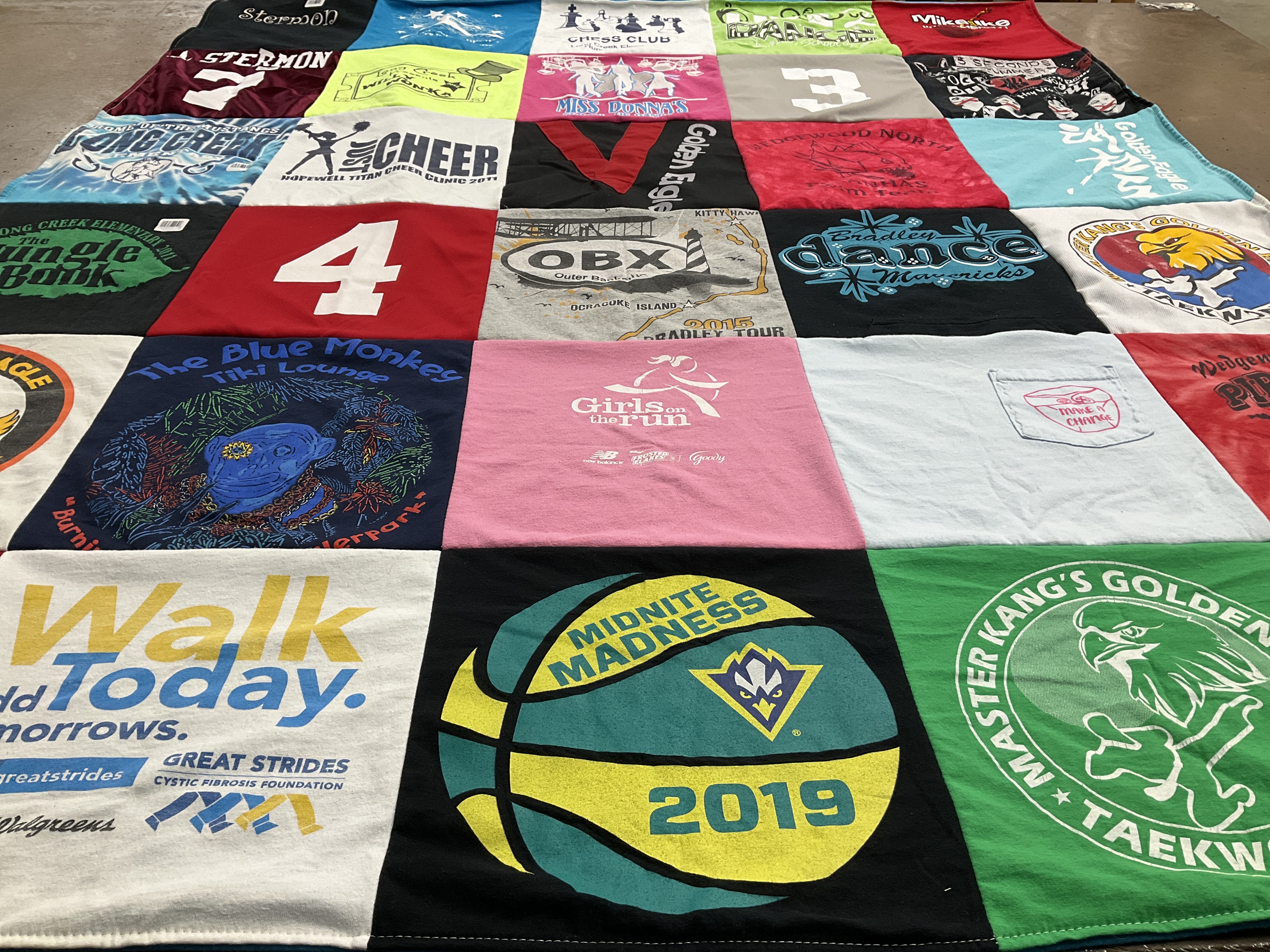 T-shirt quilt with cheerleading, dancing themes by Carly from NC