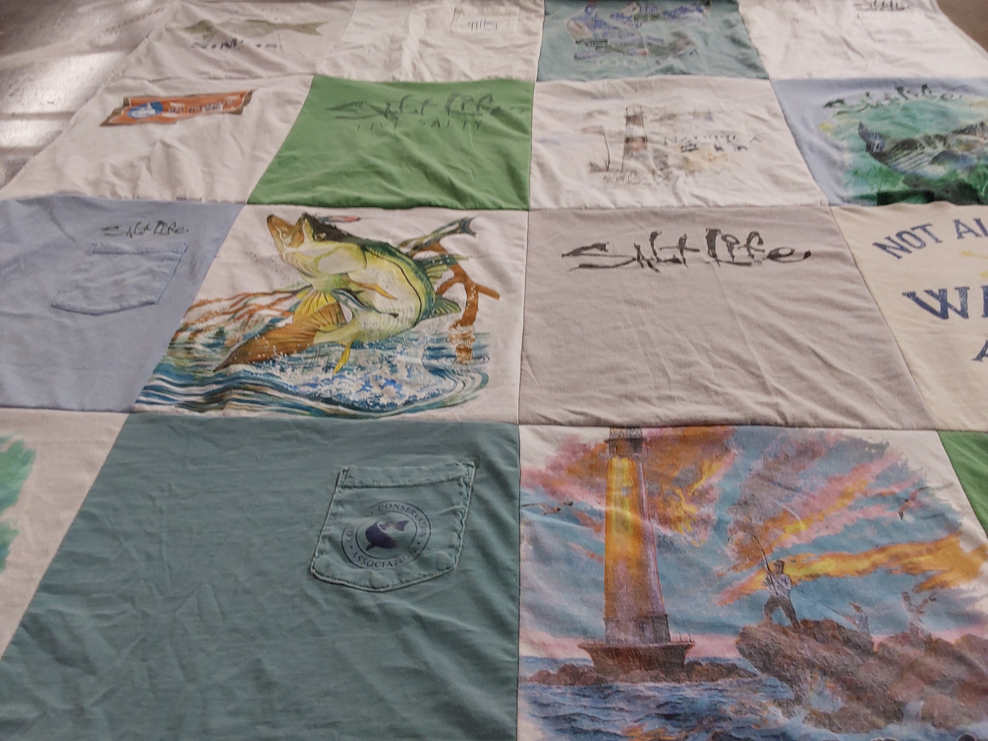 T-shirt quilt with fishing, marine life themes by Elizabeth from FL
