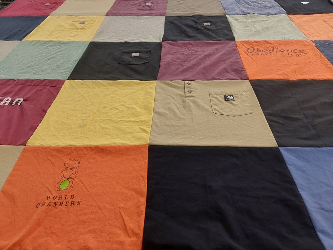 T-shirt quilt with serving, community themes by Jessica from NC