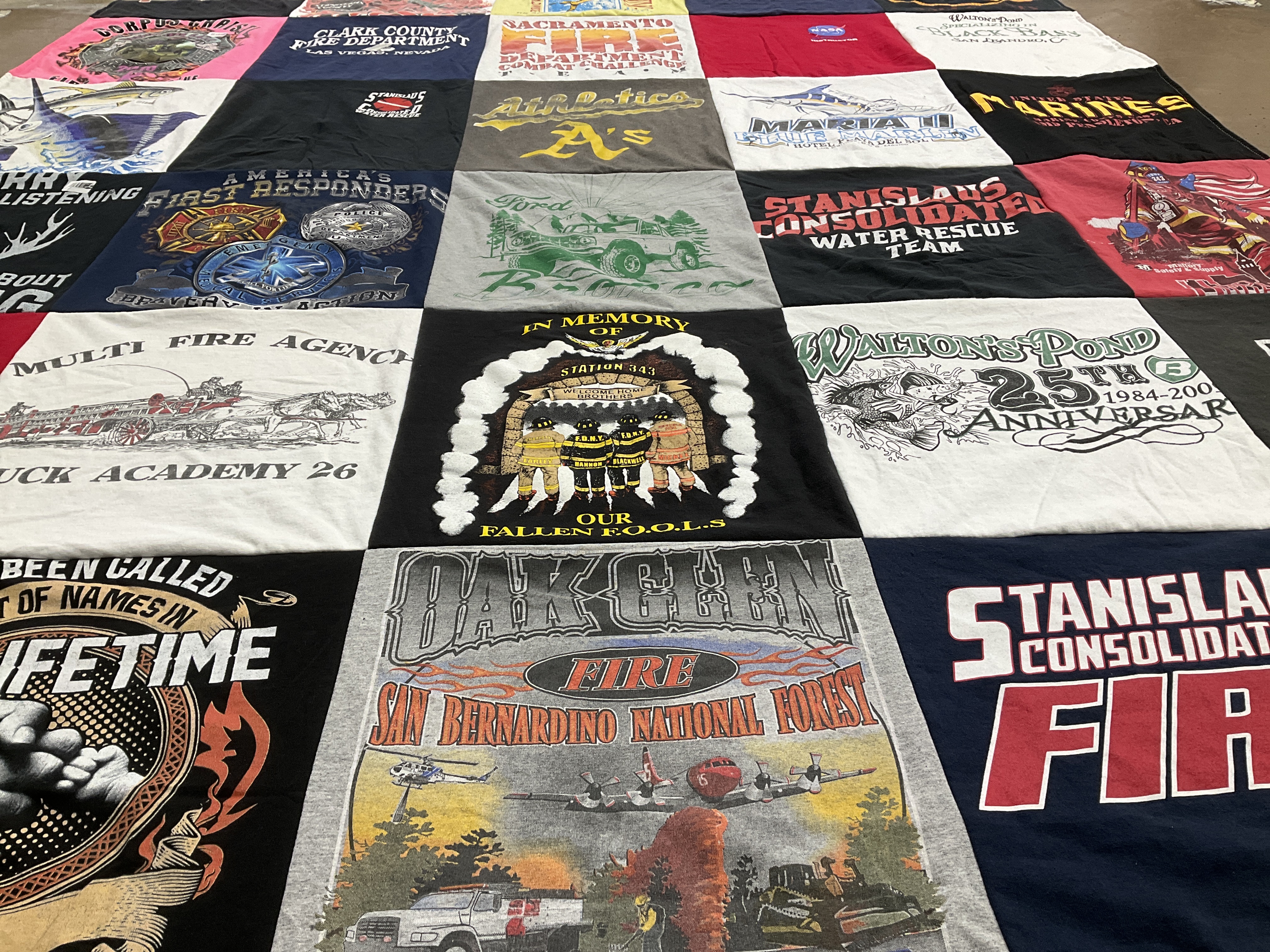 T-shirt quilt with firefighting, emergency services themes by Gina from CA