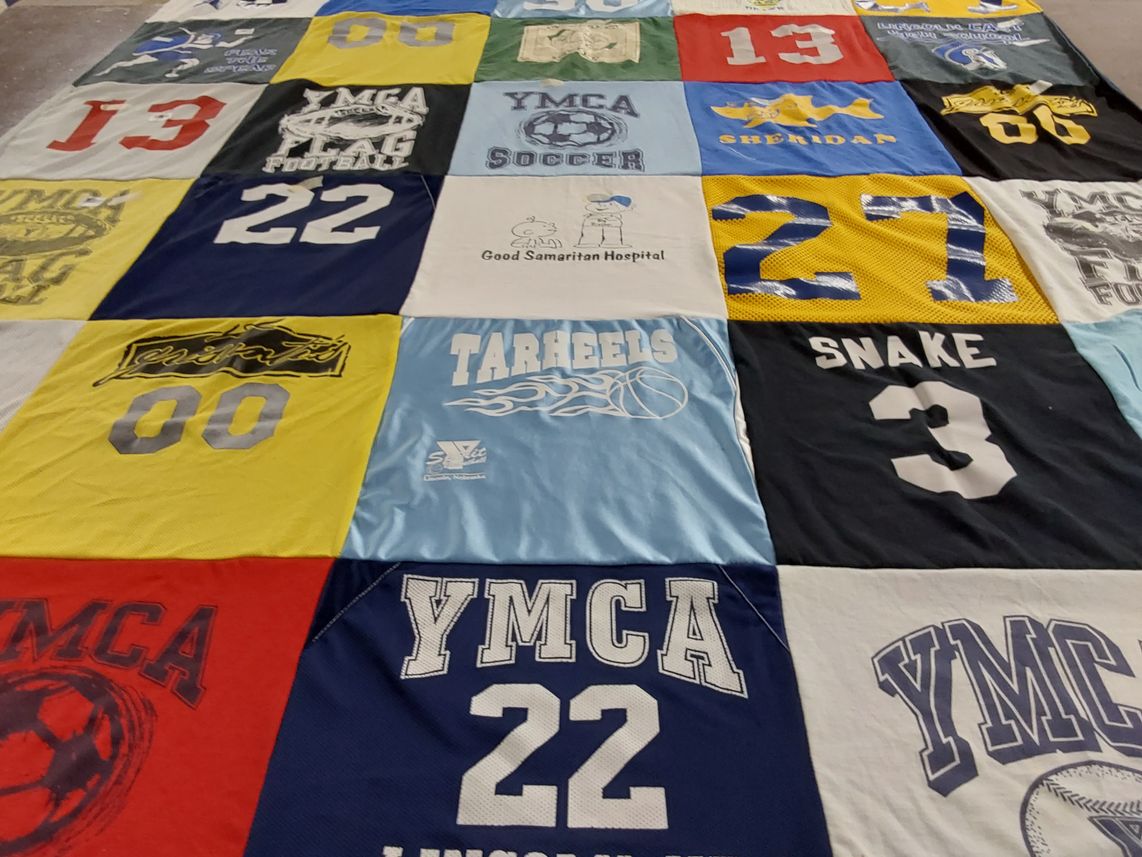 T-shirt quilt with sports, youth programs themes by Suzanne from NE