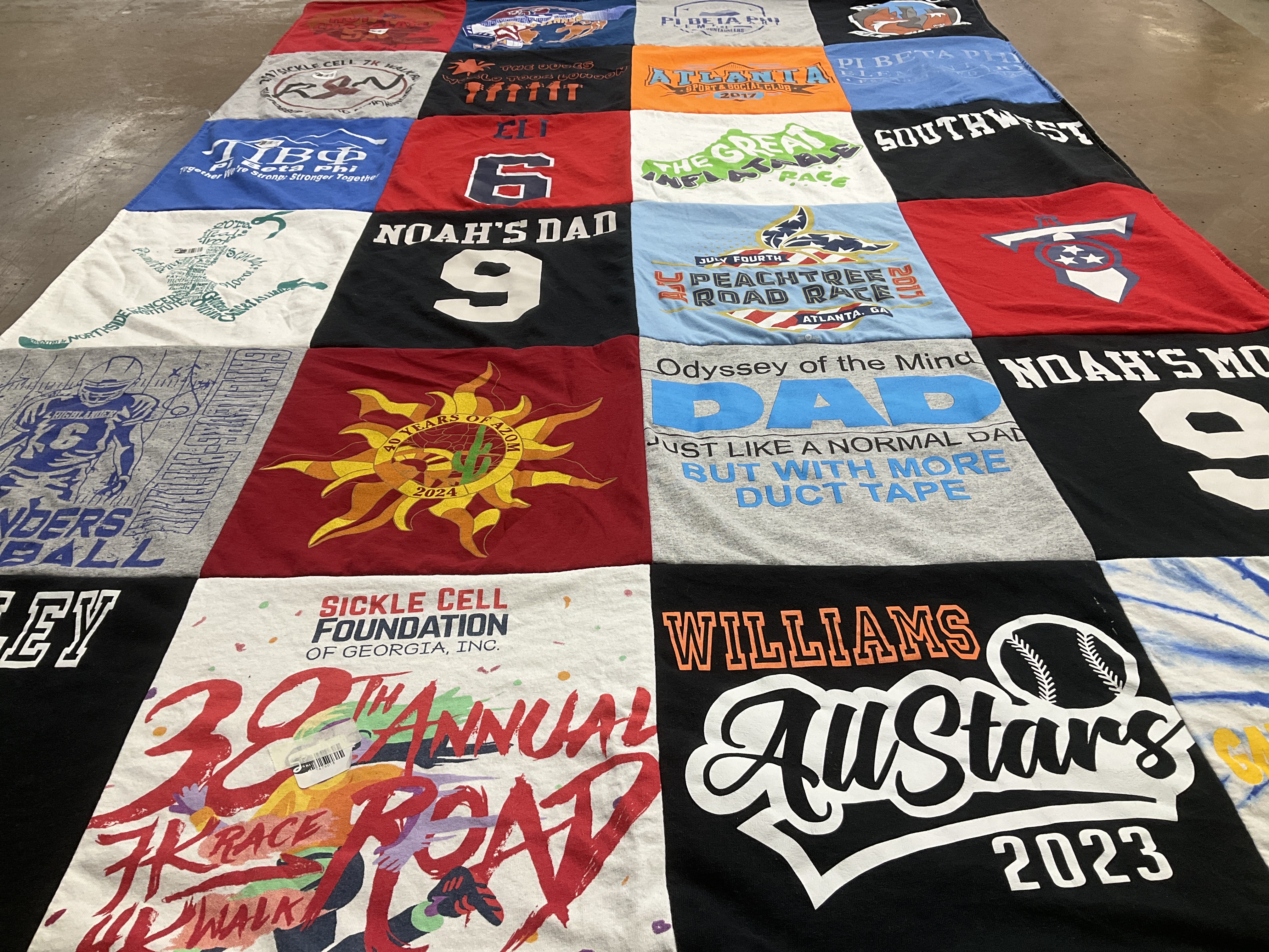 T-shirt quilt with sickle cell awareness, family themes by Raukisha from CO