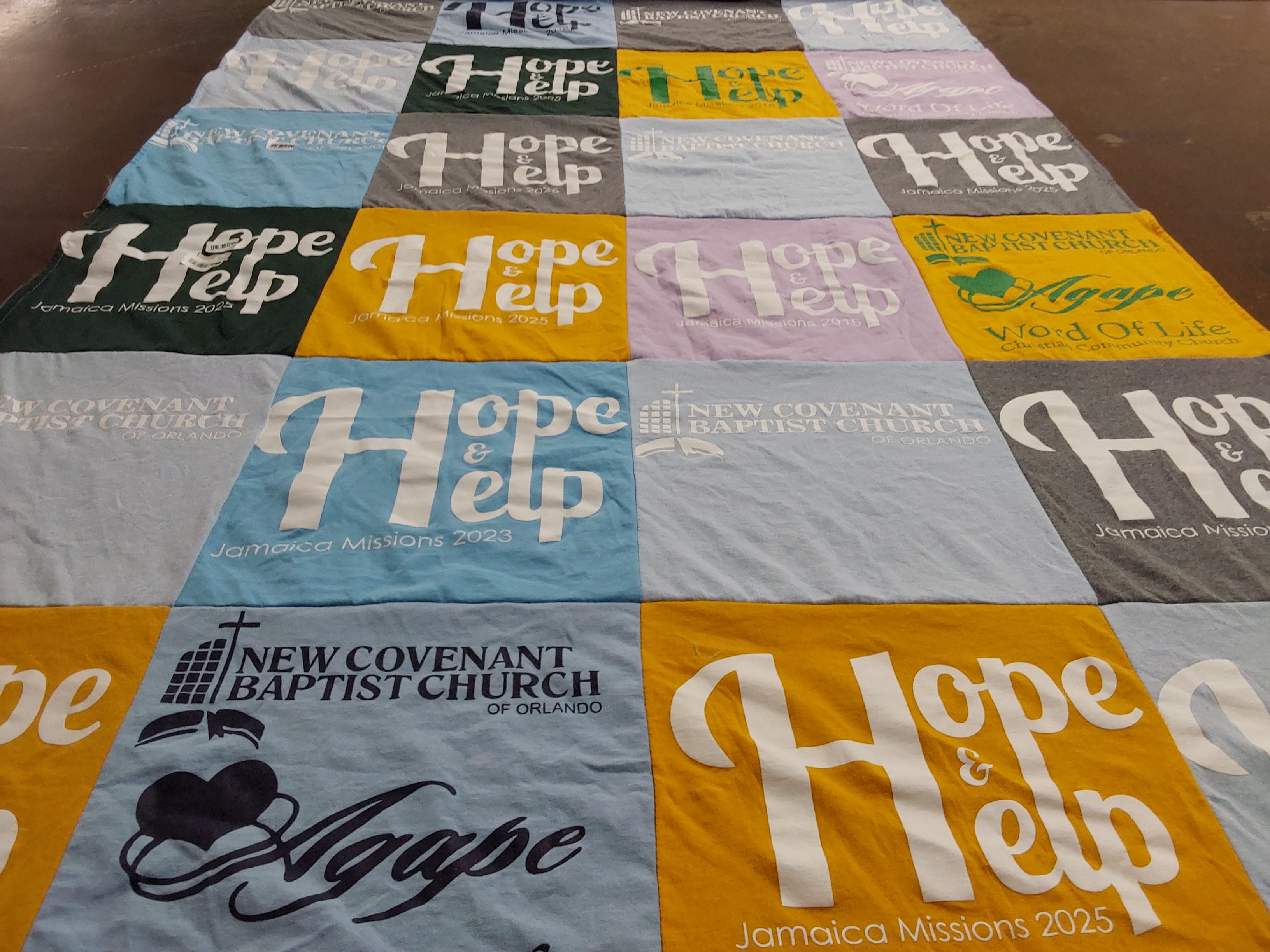 T-shirt quilt with missions, community service themes by Sharon from FL