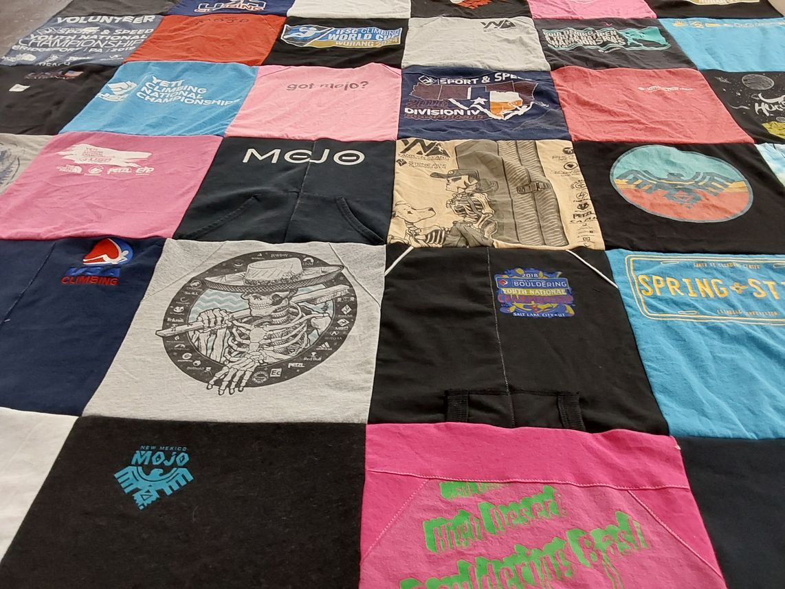 T-shirt quilt with rock climbing, bouldering themes by Tammy from NM