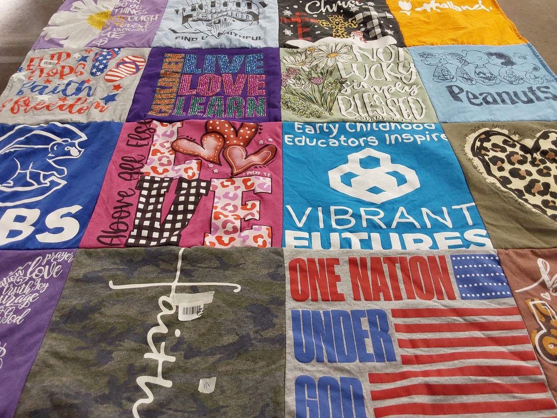 T-shirt quilt with education, childhood development themes by Lori from MI