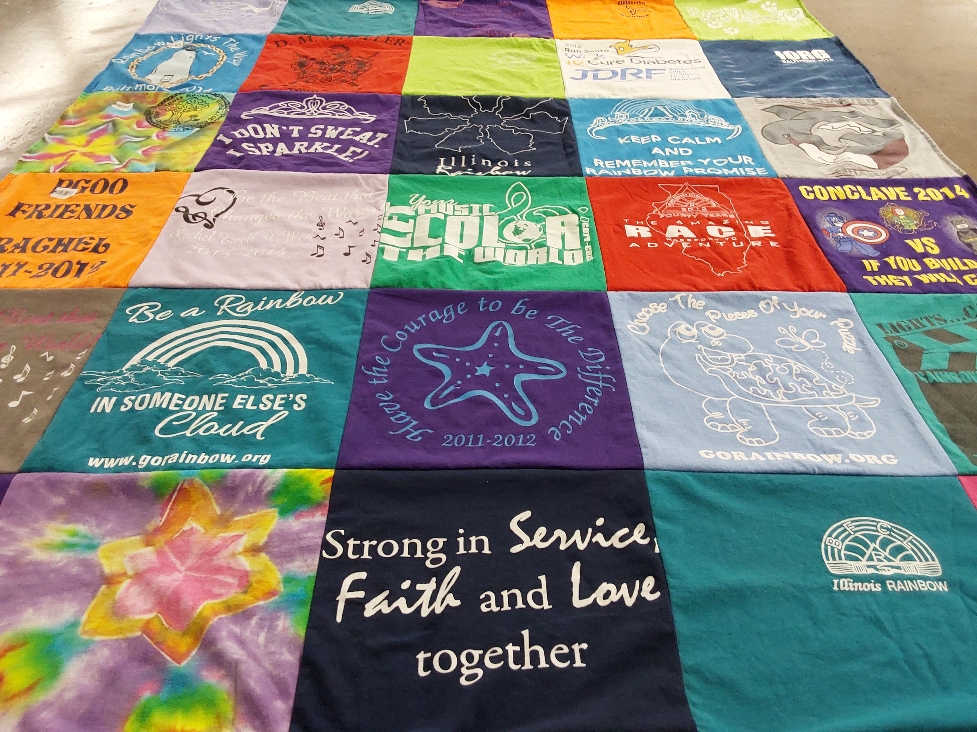 T-shirt quilt with rainbow, community themes by Laura from IL