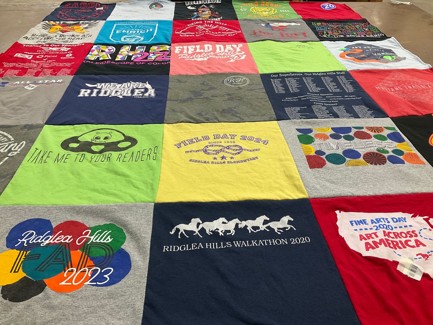 T-shirt quilt with reading, art themes by Emily from TX