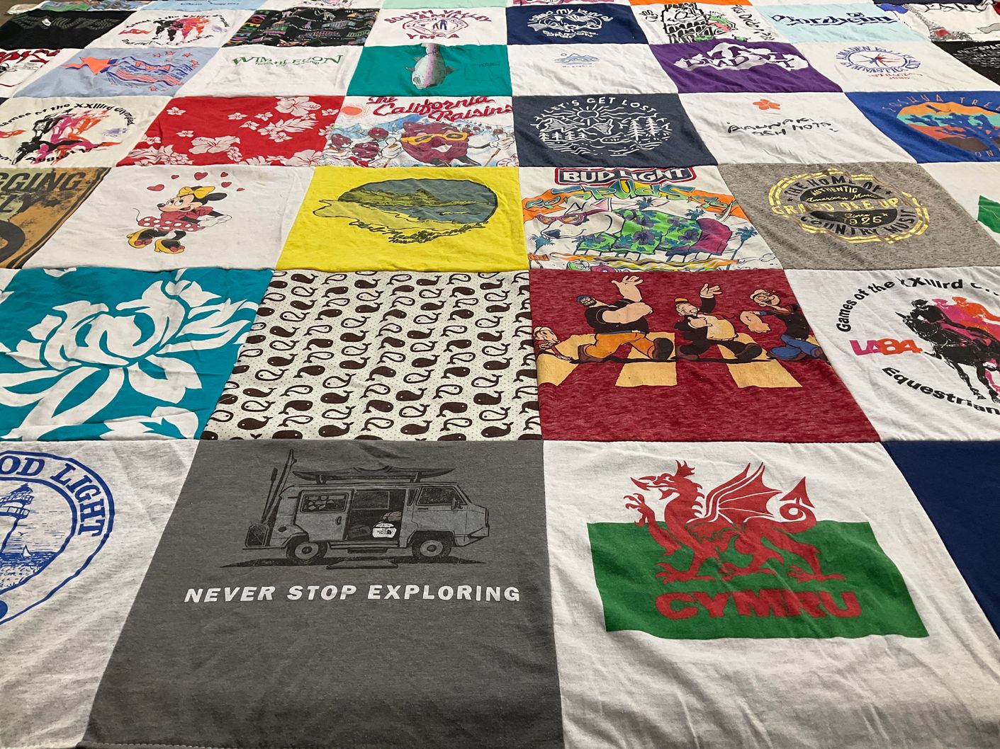 T-shirt quilt with travel, outdoor activities themes by Jennifer from ID