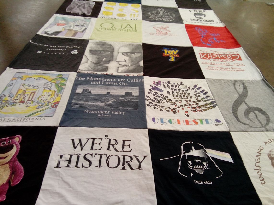 T-shirt quilt with music, travel themes by Debbie from CA