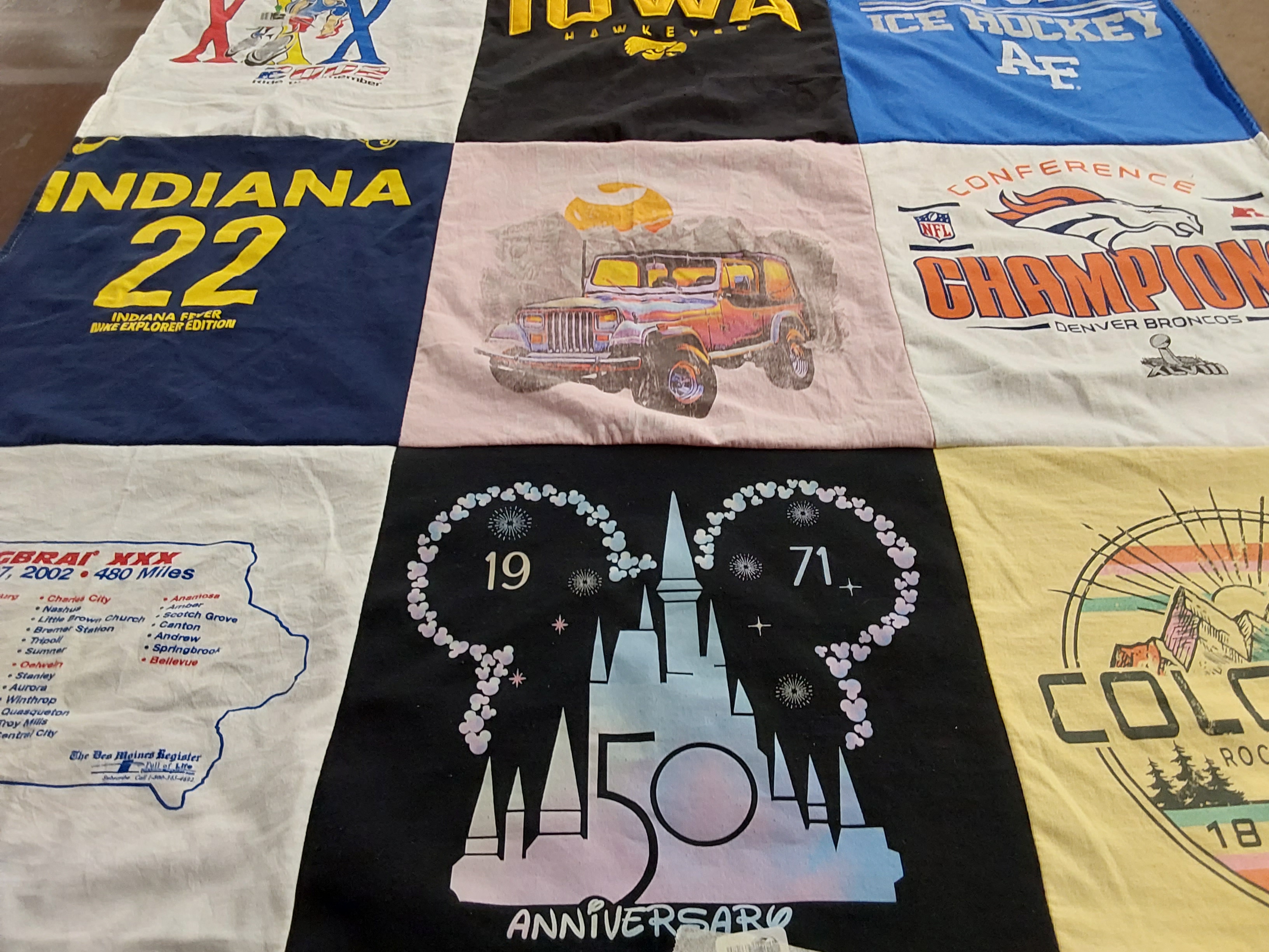 T-shirt quilt with hockey, motorcycles themes by Mary from CO