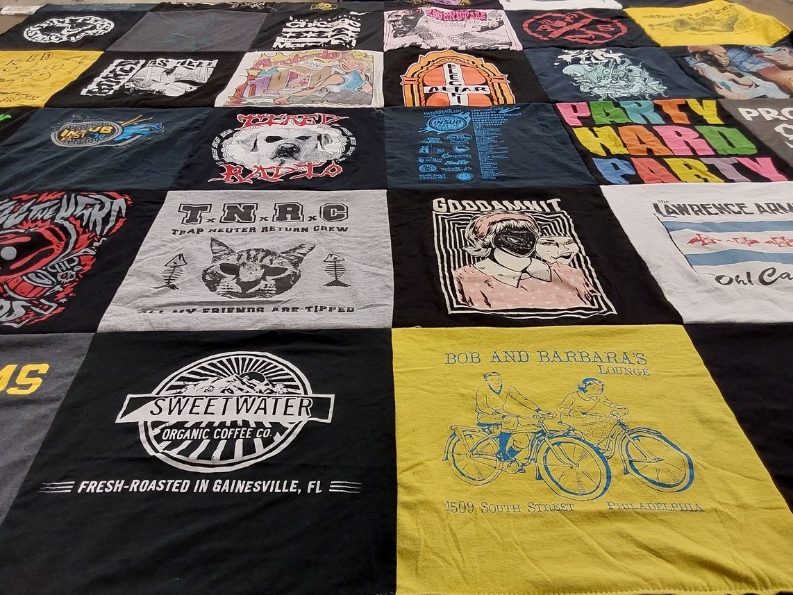 T-shirt quilt with music, community themes by Katie from PA