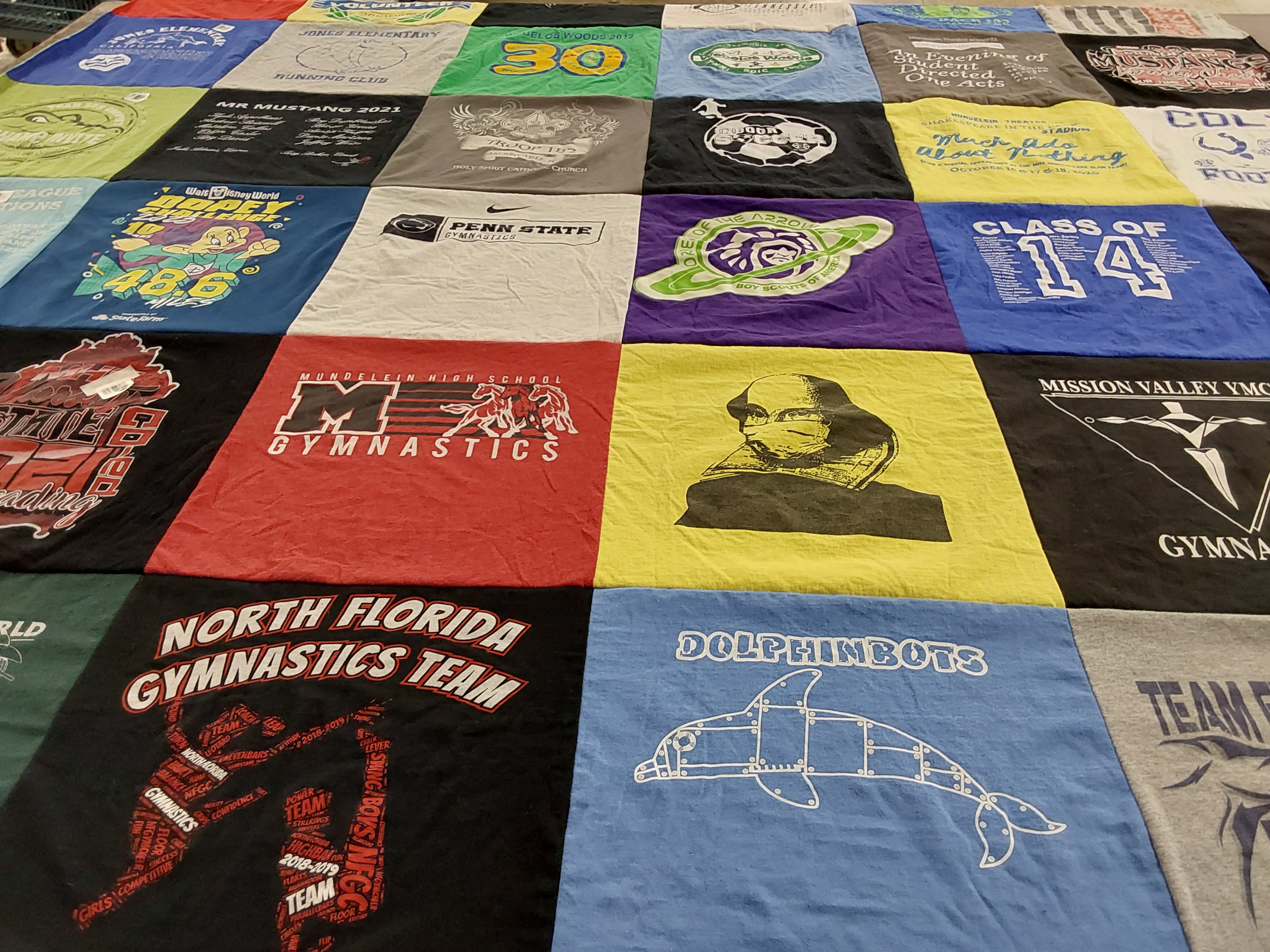 T-shirt quilt featuring north florida gymnastics team, dolphinbots by nicole from IL