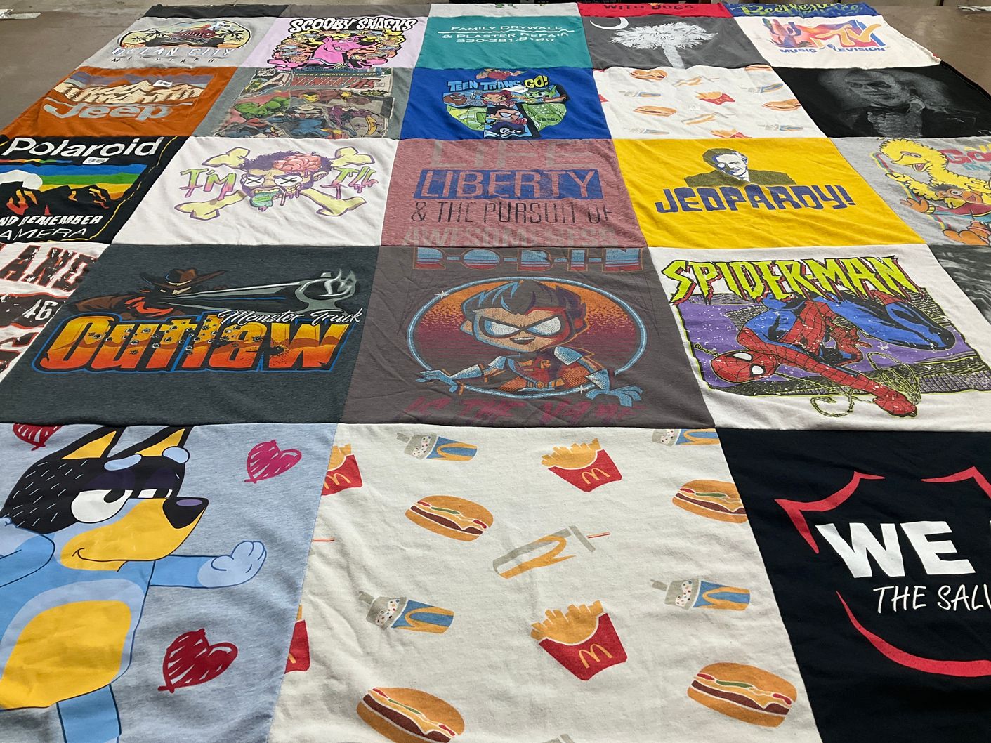 T-shirt quilt with cartoons, tv shows themes by Sandi from OH
