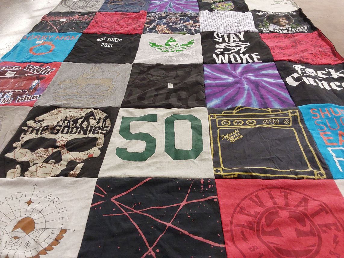 T-shirt quilt with music, pop culture themes by Beckem from MA