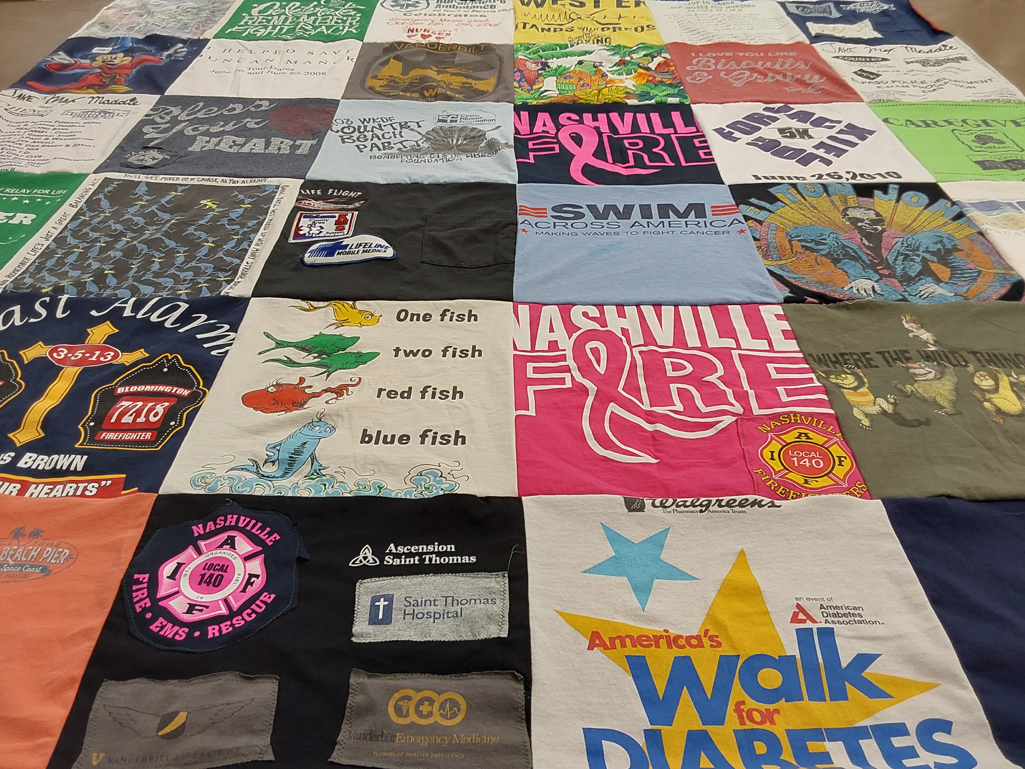T-shirt quilt with swimming, firefighting themes by Kristina from TN